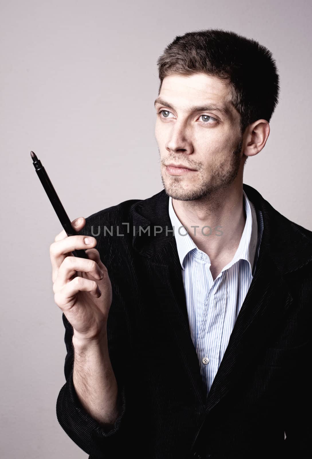 Man thinking about a solution with a pencil