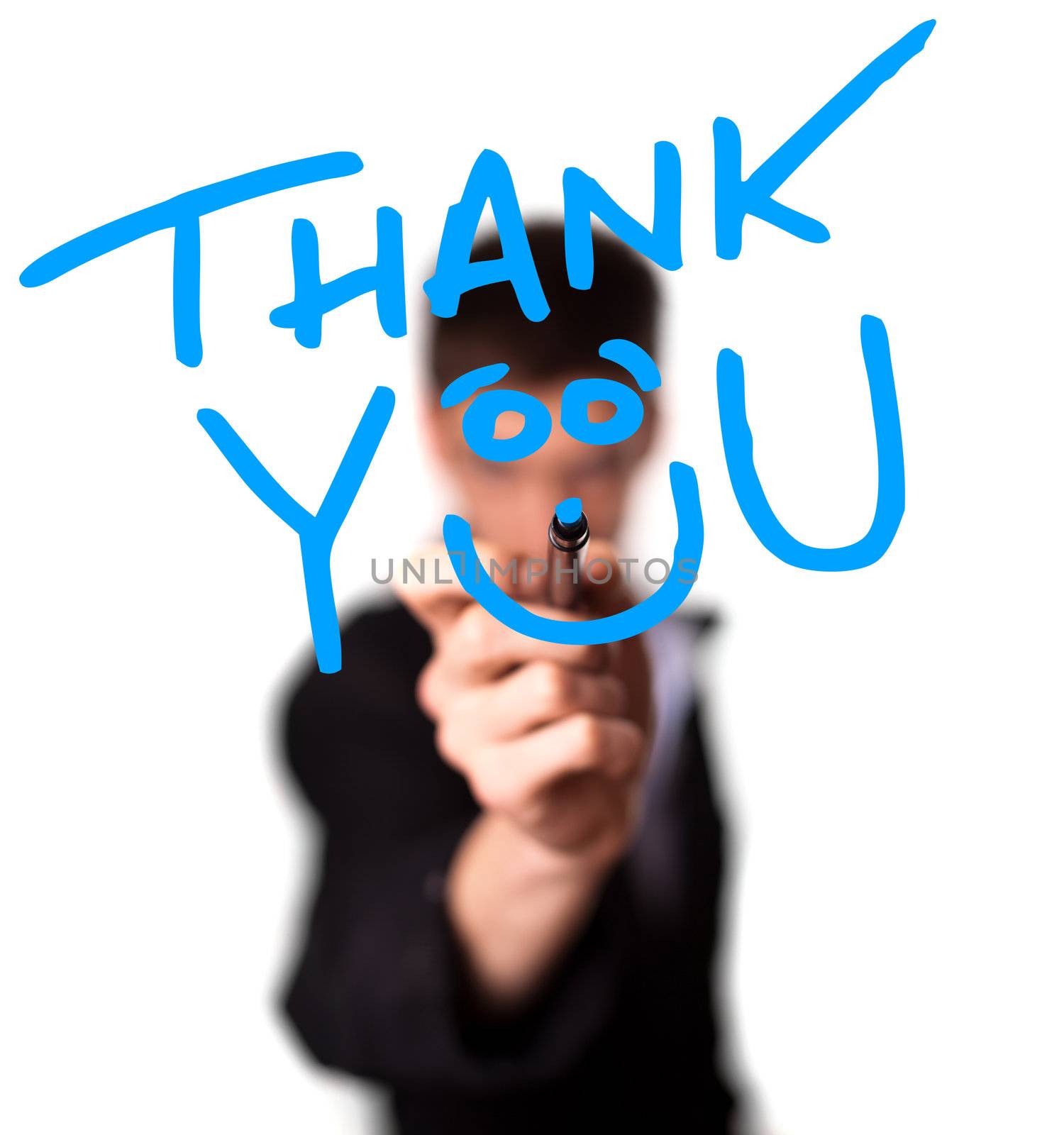 Young man writing Thank YOU on whiteboard, selective focus