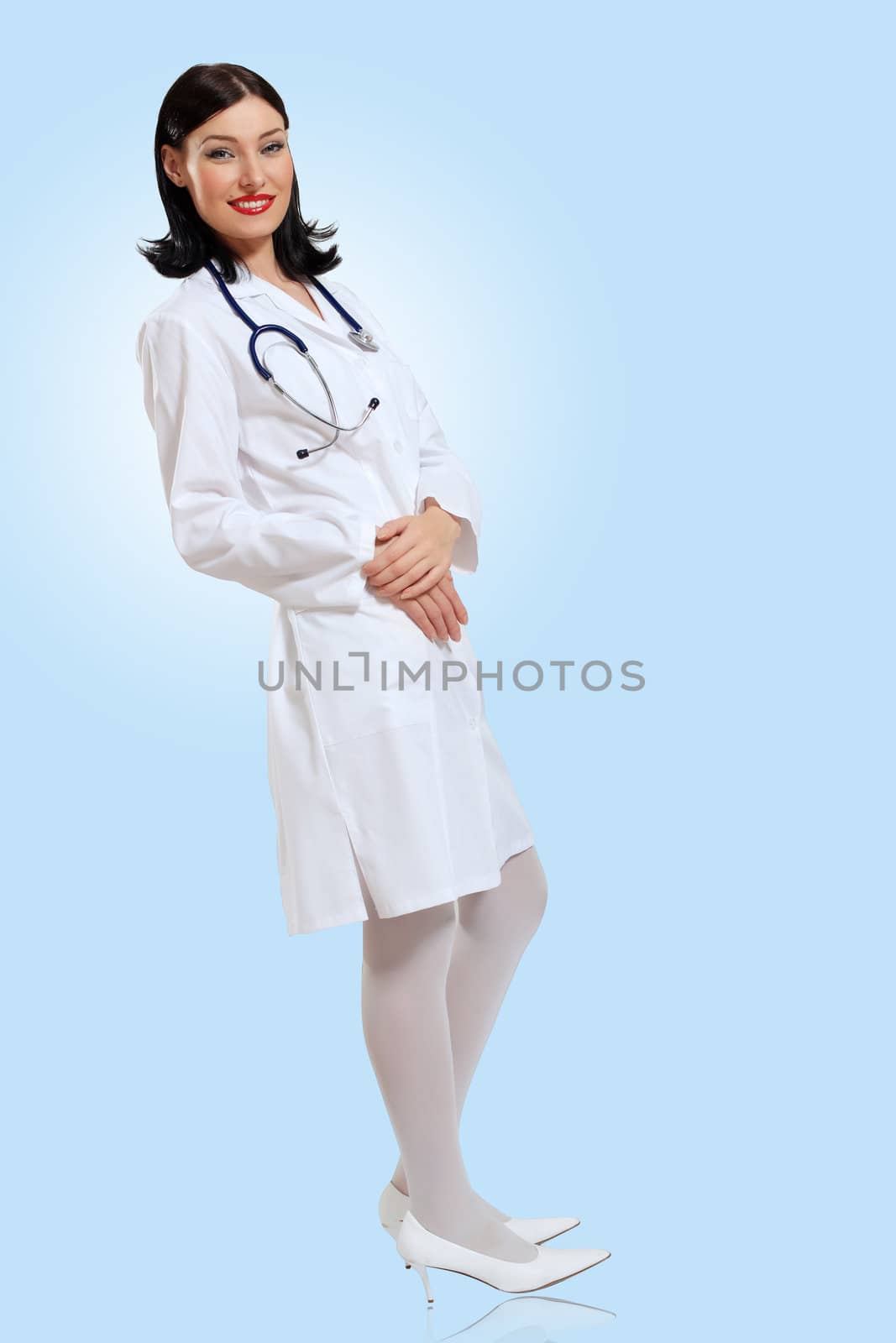 Portrait of happy successful young female doctor holding a stethoscope