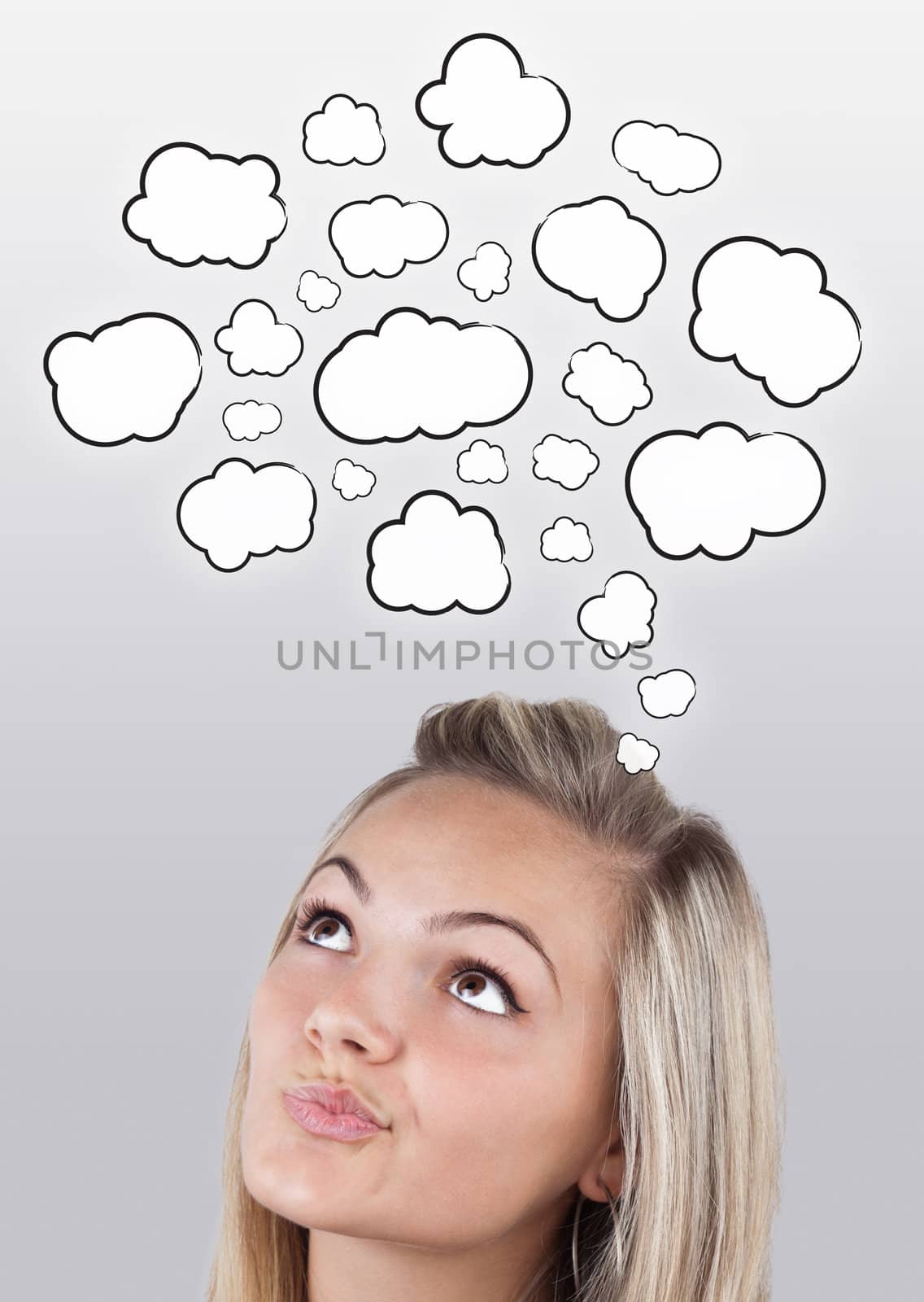 Young girl head thinking about white clouds