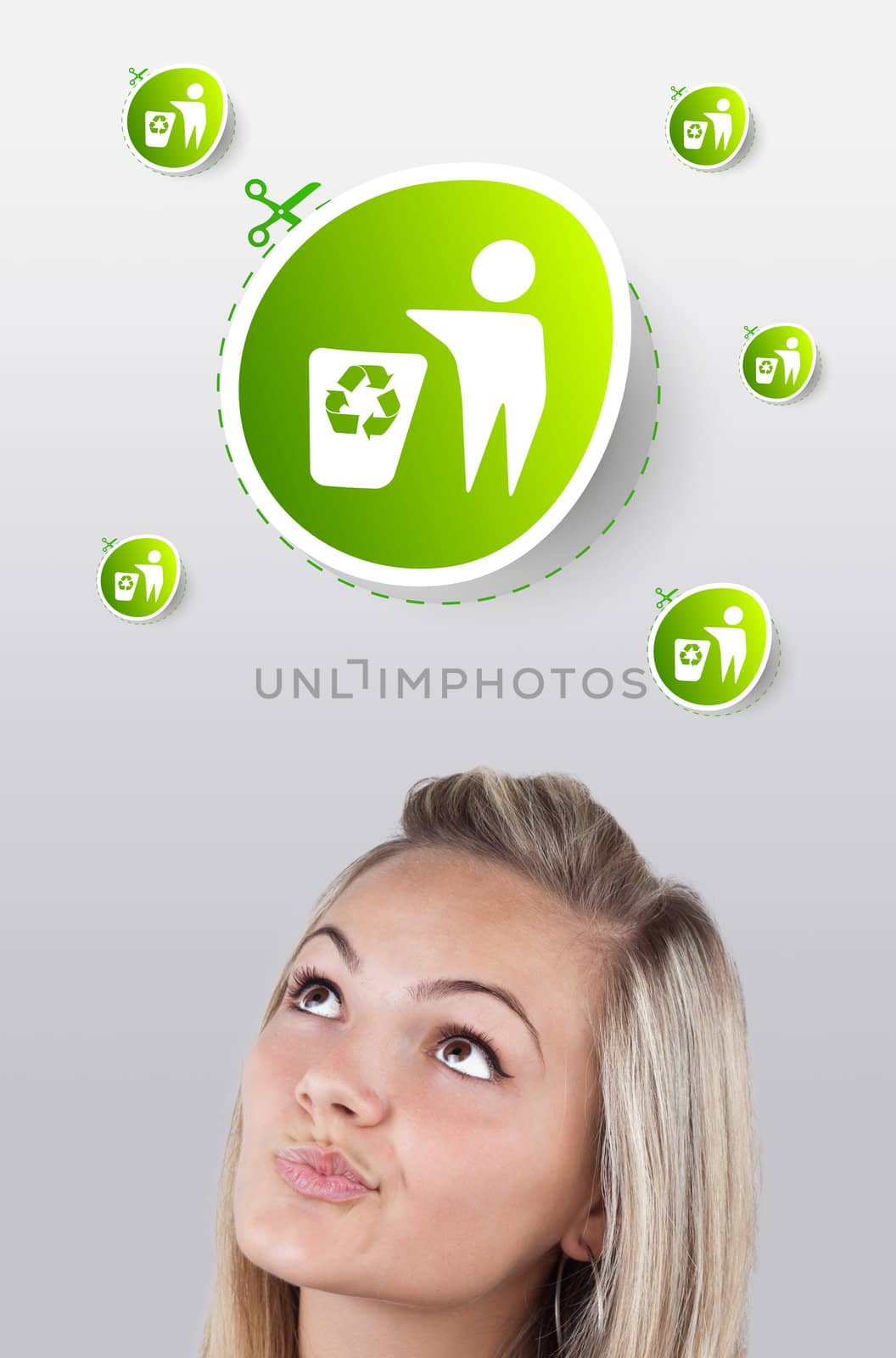 Young girl looking at green eco sign by ra2studio