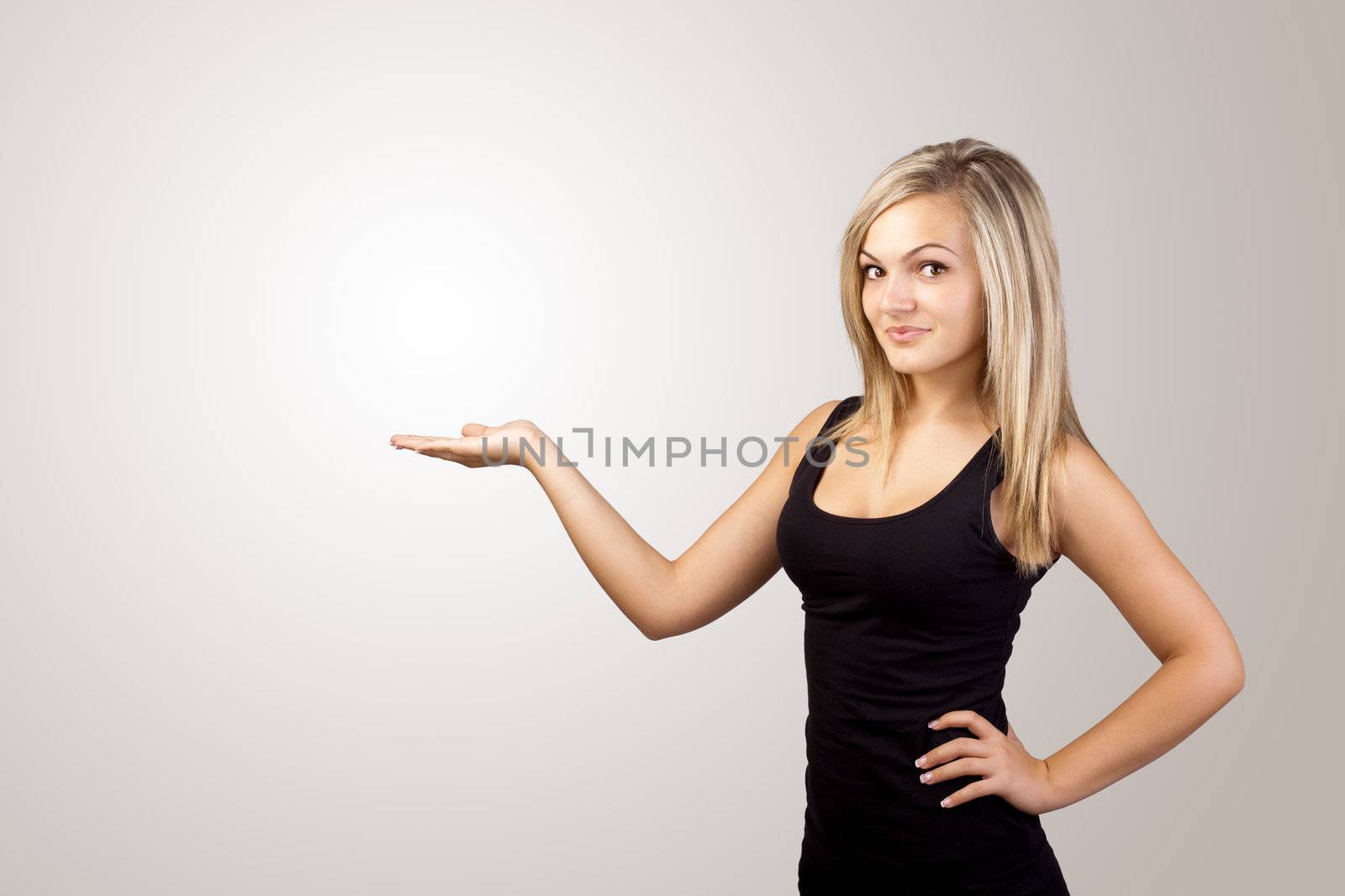 blonde woman presenting hand, copyspace on left