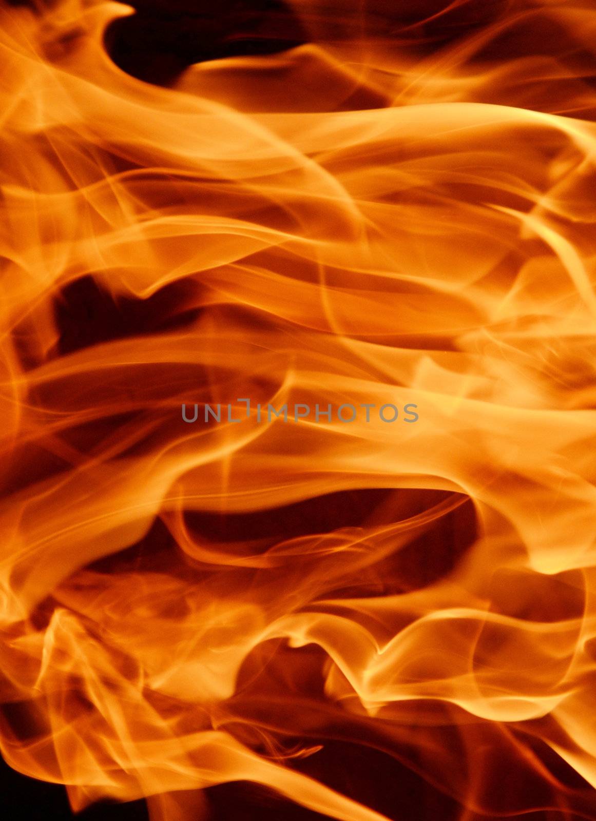 Abstract background / backdrop representing fire. flame pattern with dark and light spots. Can be used as a wallpaper