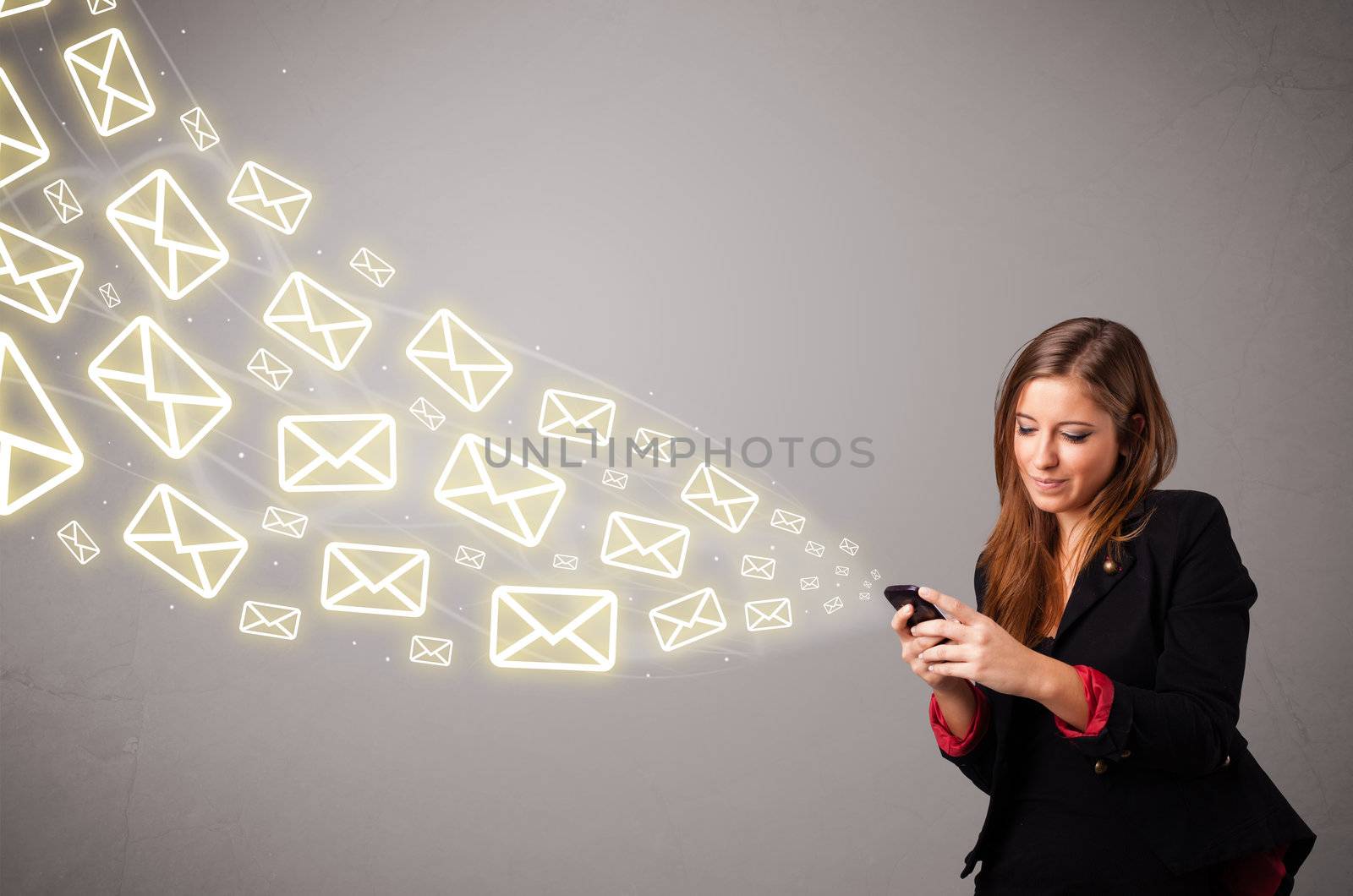 attractive young lady standing and holding a phone with message icons