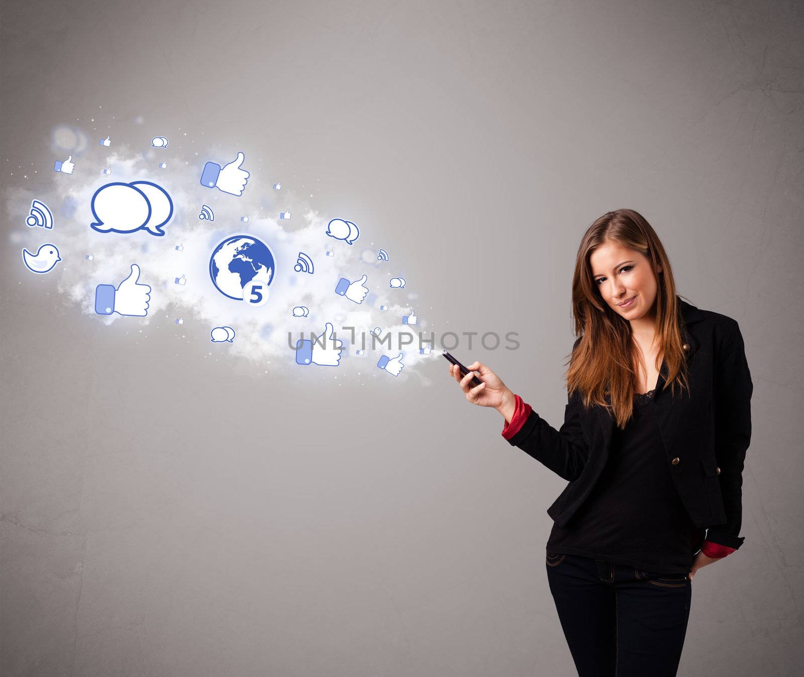 Pretty young girl holding a phone with social media icons in abstract cloud