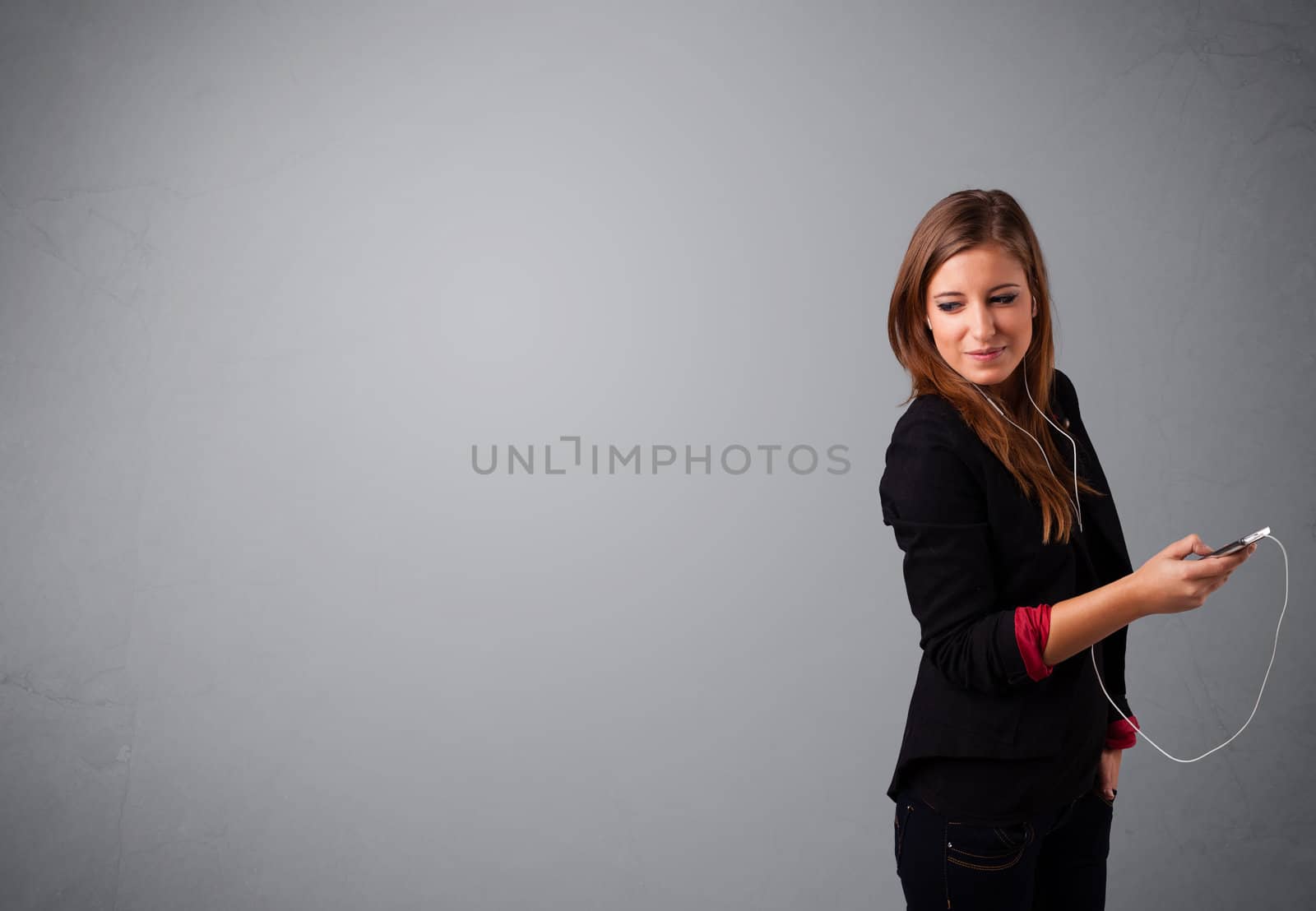 pretty young lady singing and listening to music with copy space