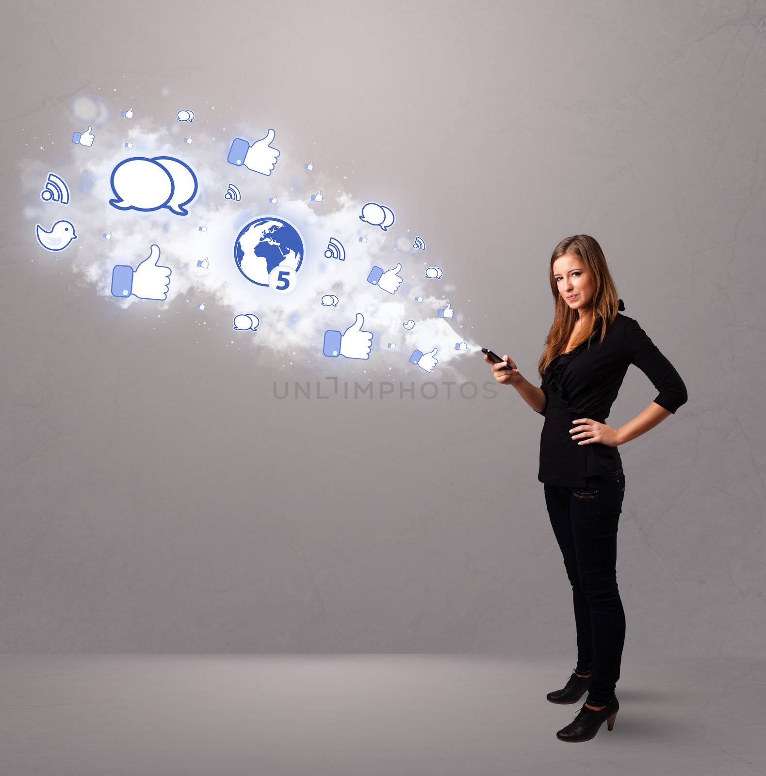Pretty young girl holding a phone with social media icons in abstract cloud
