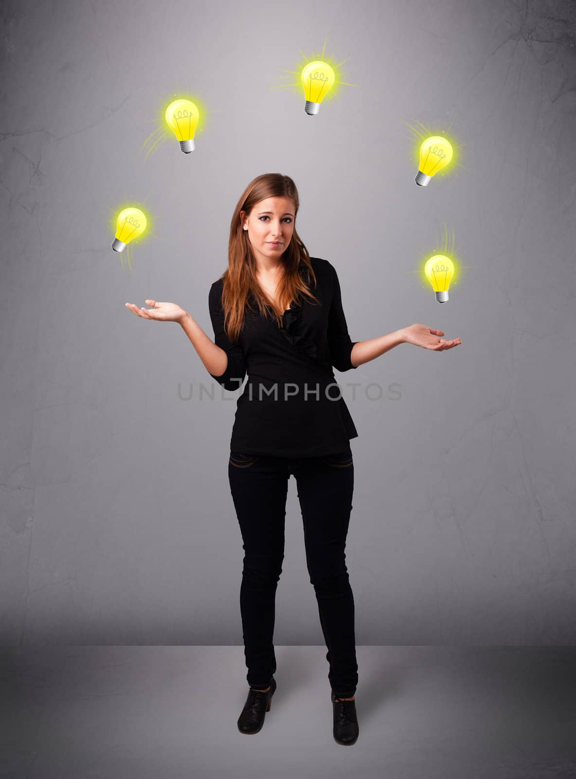 beautiful young lady standing and juggling with light bulbs