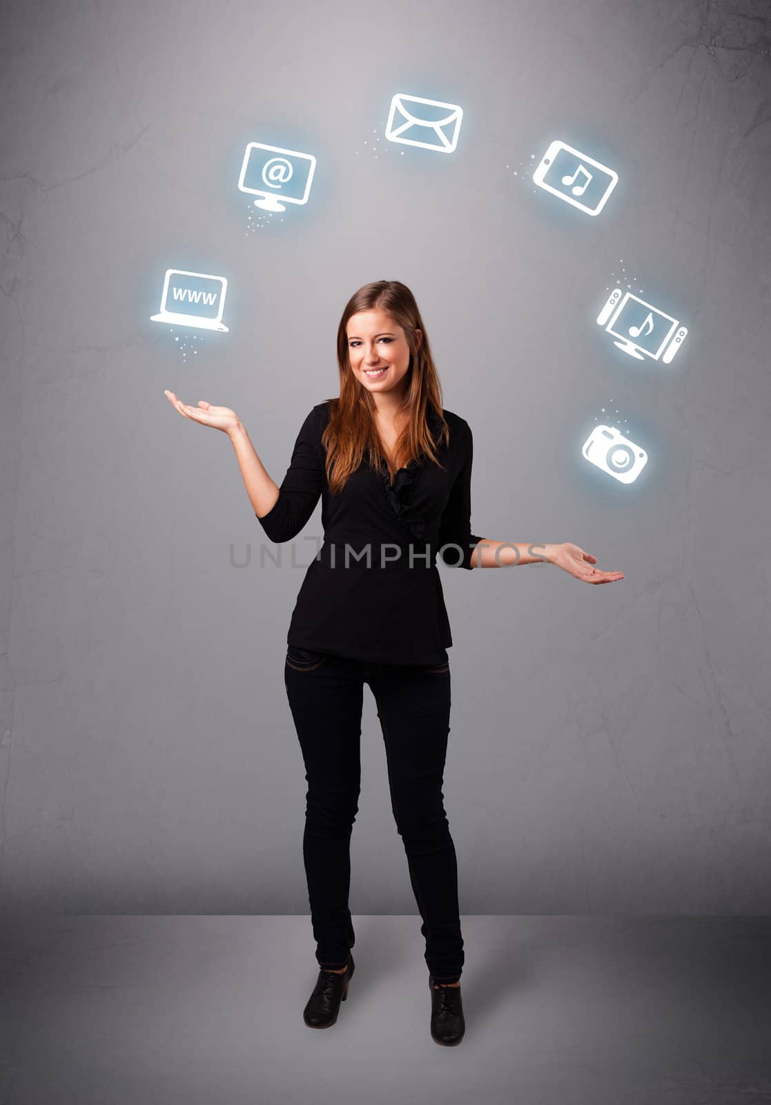 pretty girl standing and juggling with elecrtonic devices icons