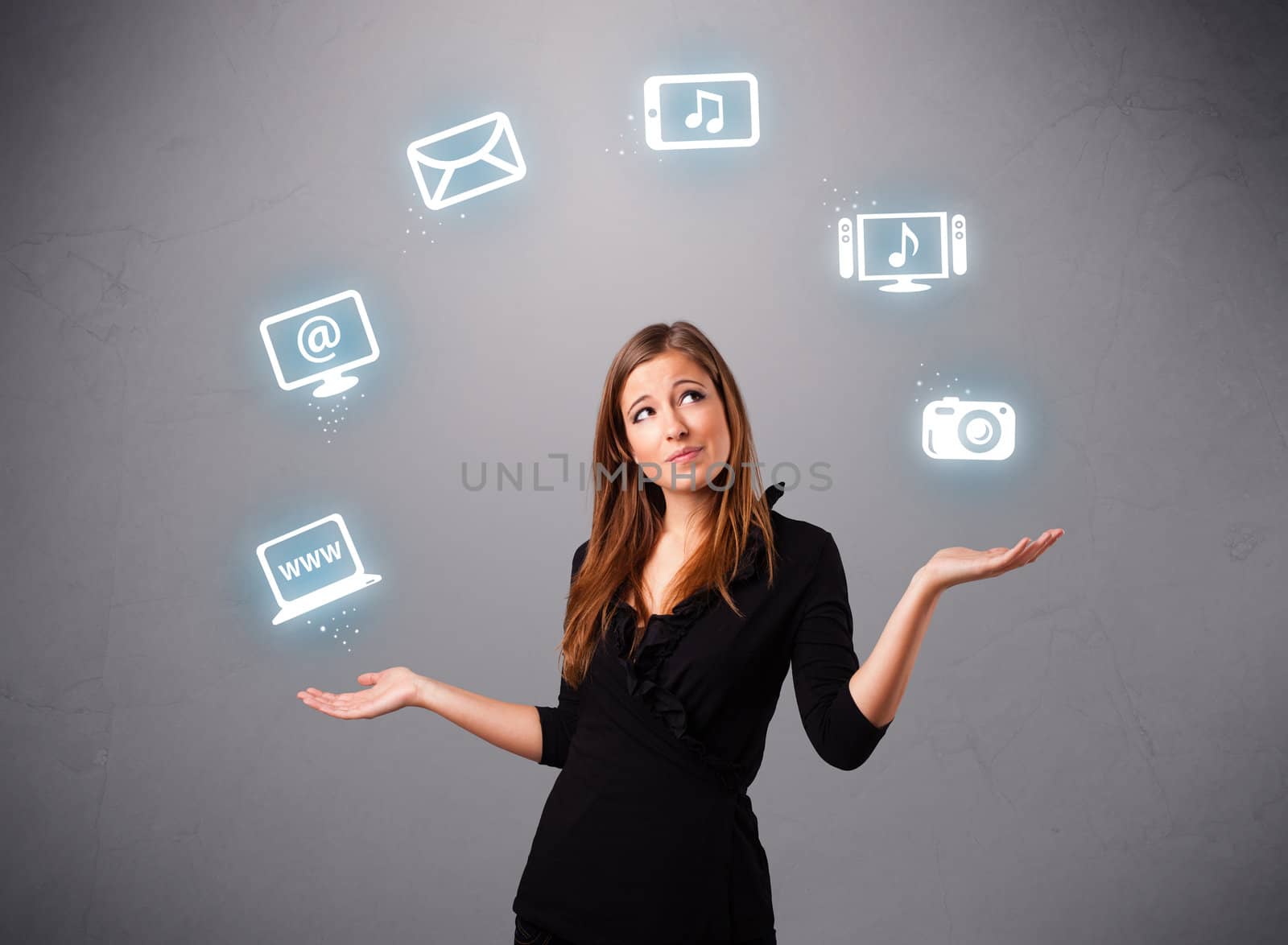 pretty girl standing and juggling with elecrtonic devices icons