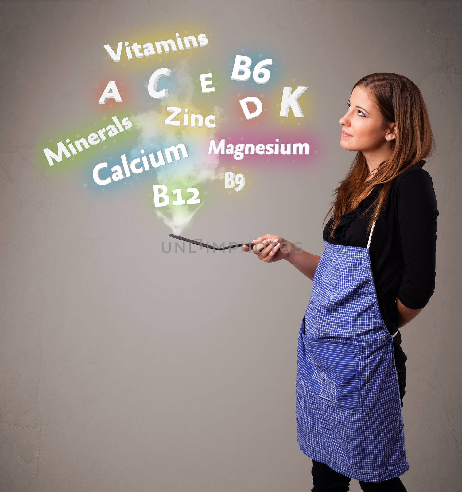 Pretty young woman cooking vitamins and minerals