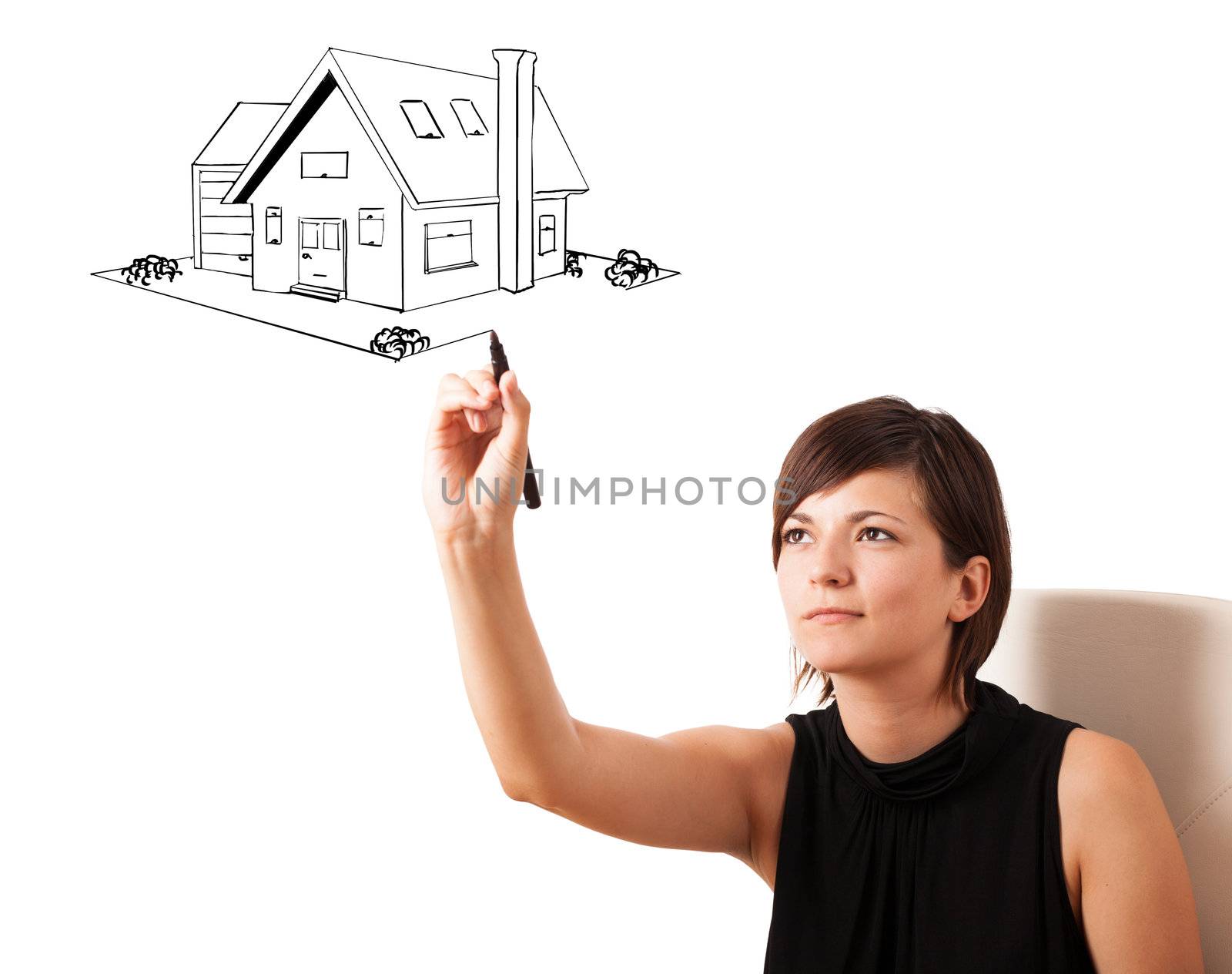 Young woman drawing a house on whiteboard by ra2studio