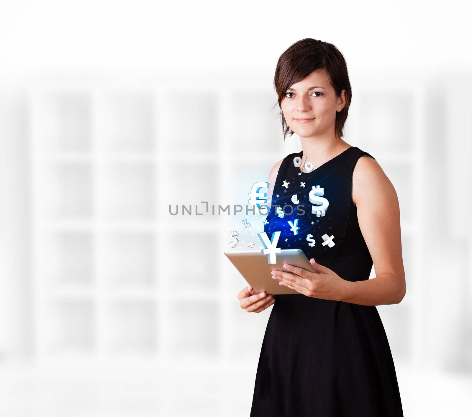 Young business woman looking at modern tablet with currency icons