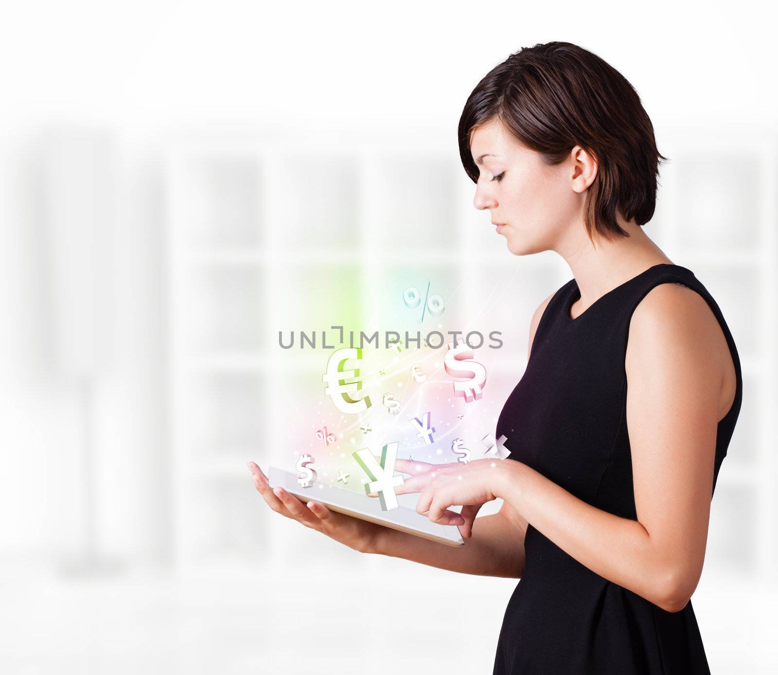 Young business woman looking at modern tablet with currency icons