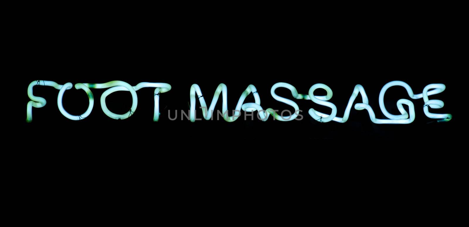 Foot massage blue  neon sign on black background