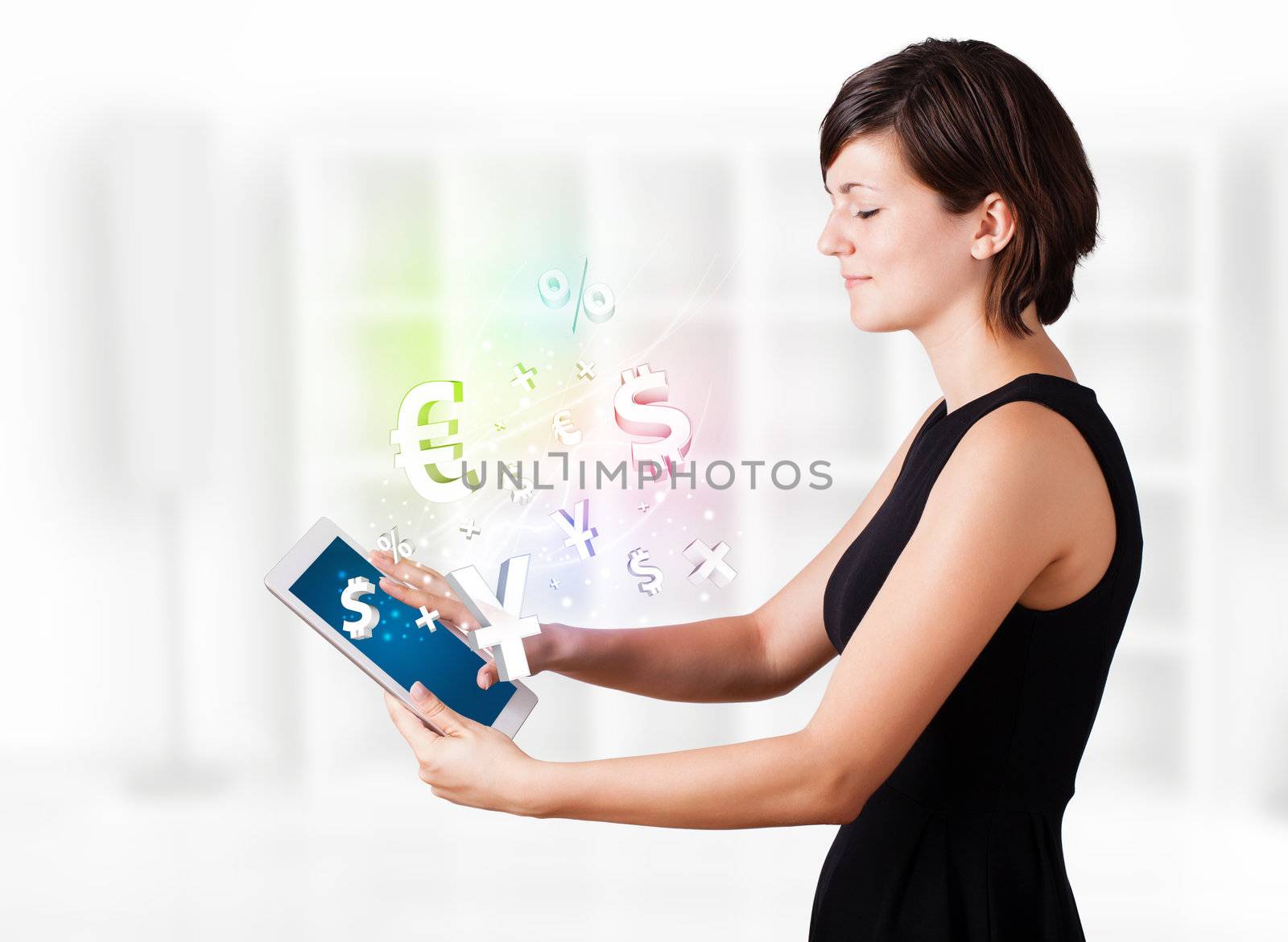 Young business woman looking at modern tablet with currency icons