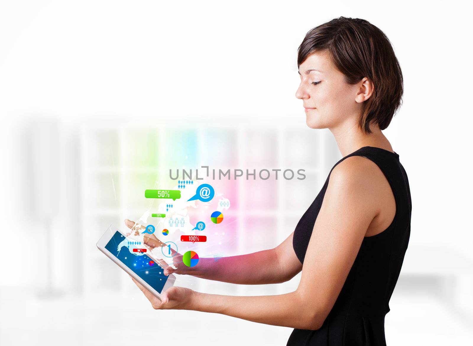 Young woman looking at modern tablet with colourful technology i by ra2studio