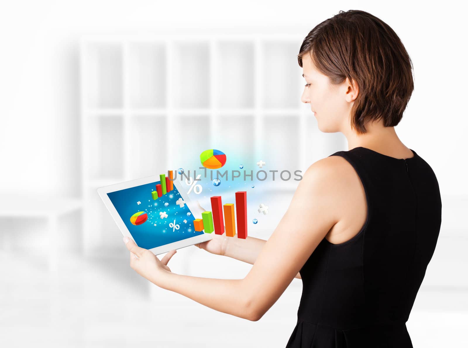 Young woman looking at modern tablet with colourful diagrams by ra2studio