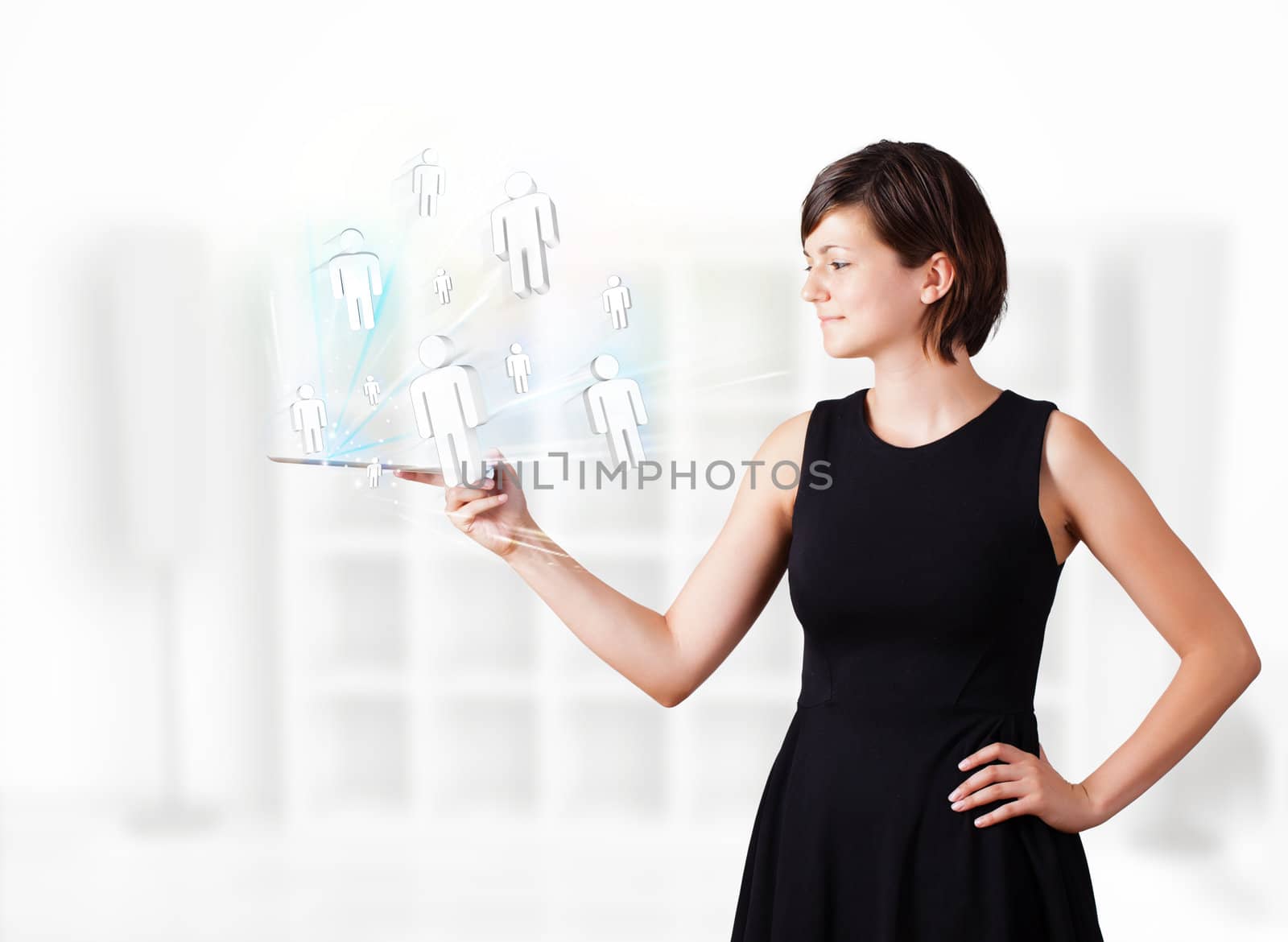 Young business woman looking at modern tablet with social icons