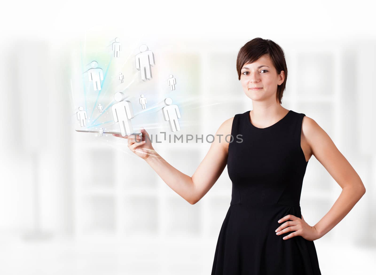 Young business woman looking at modern tablet with social icons