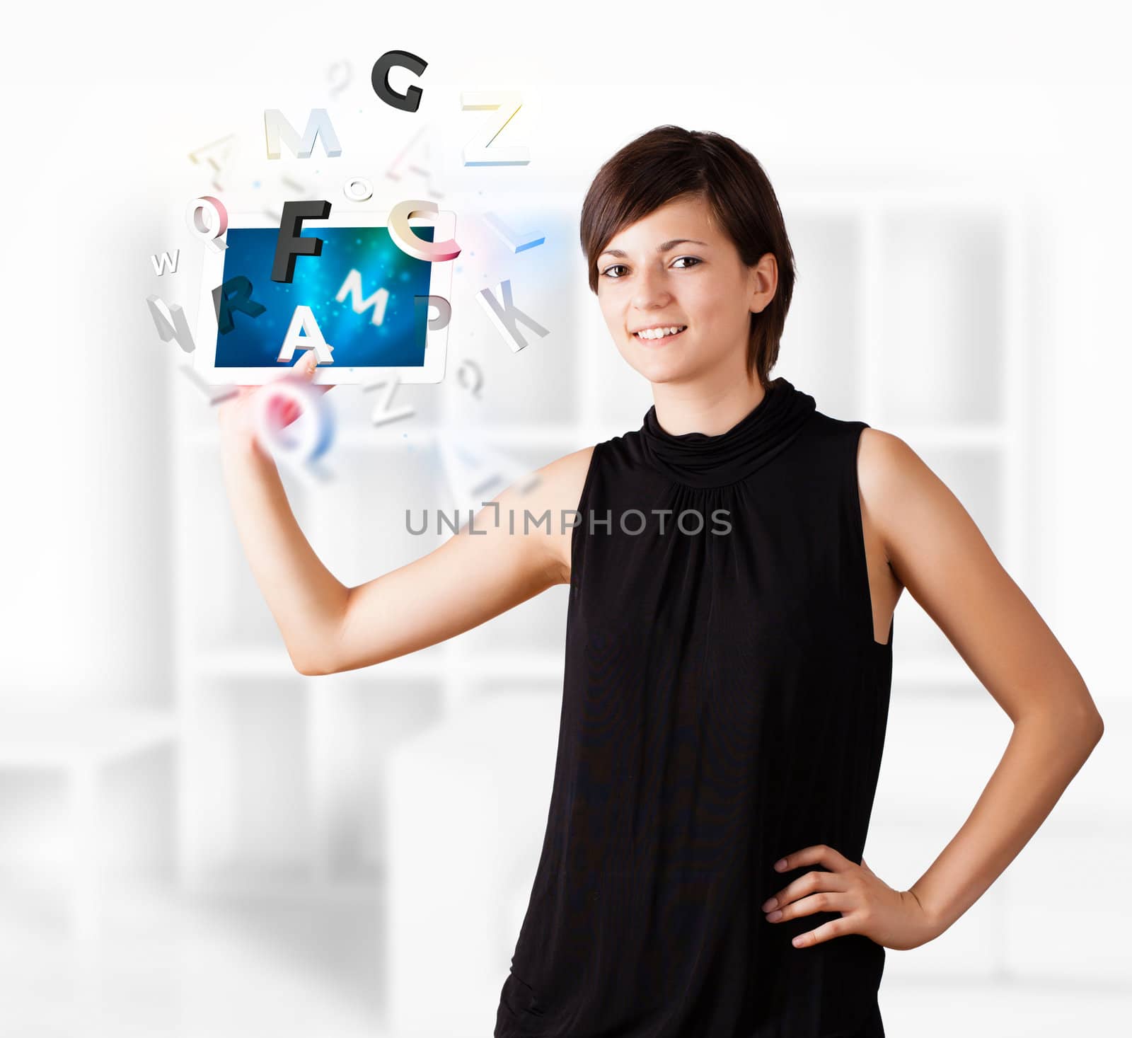 Young woman looking at modern tablet with alphabet by ra2studio