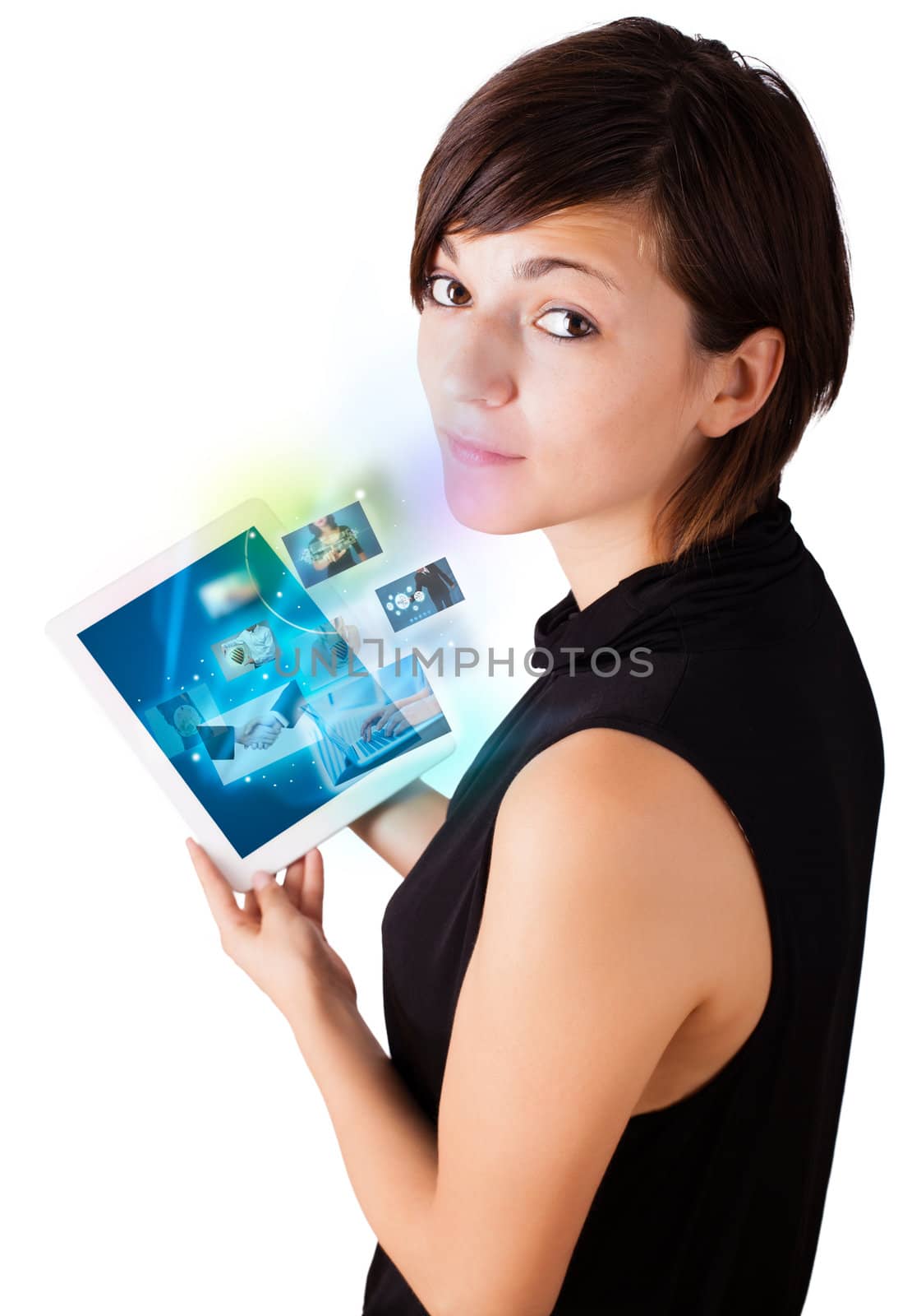 Young woman browsing pictures on modern tablet by ra2studio