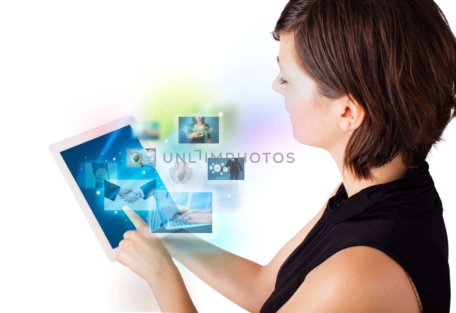 Young woman browsing pictures on modern tablet by ra2studio