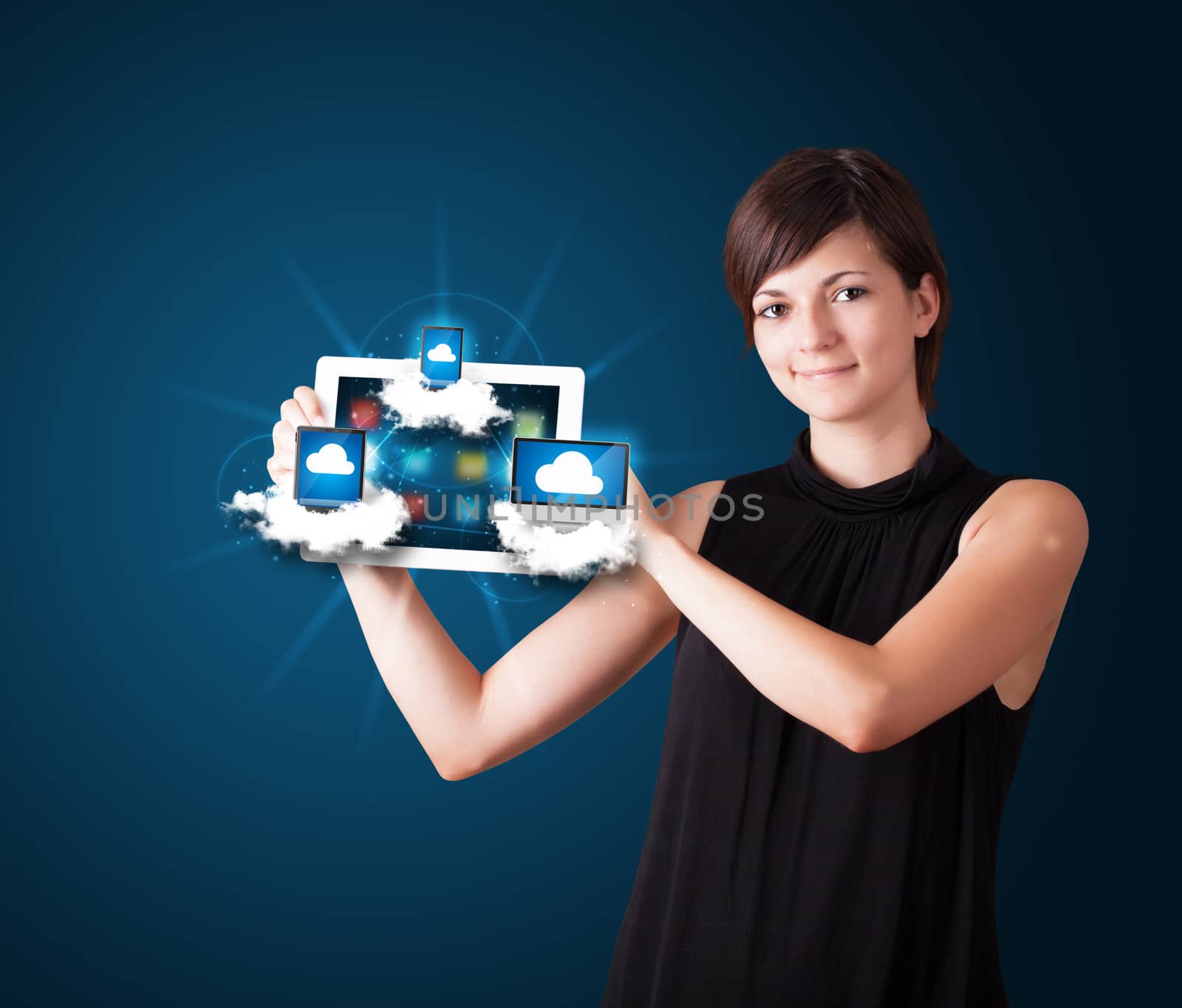 young woman holding tablet with modern devices in clouds by ra2studio
