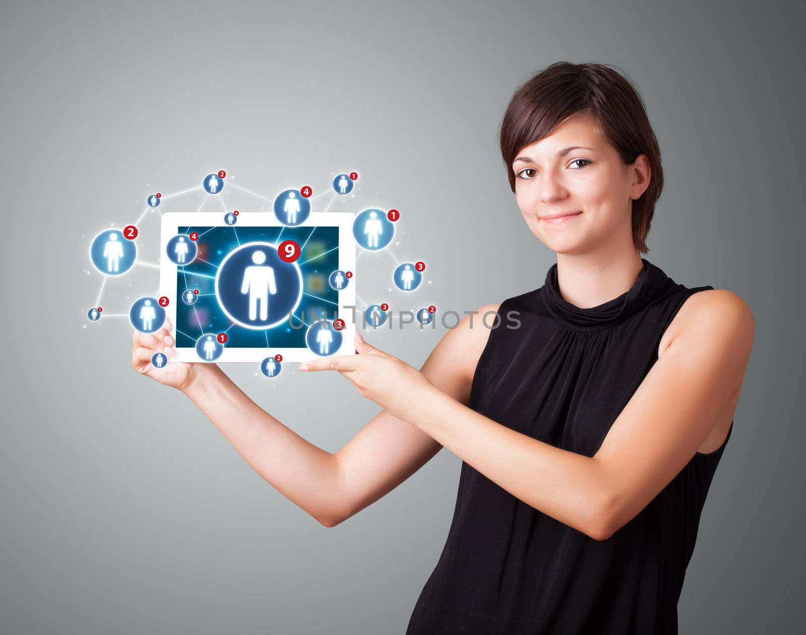 Beautiful young woman holding tablet with social network icons