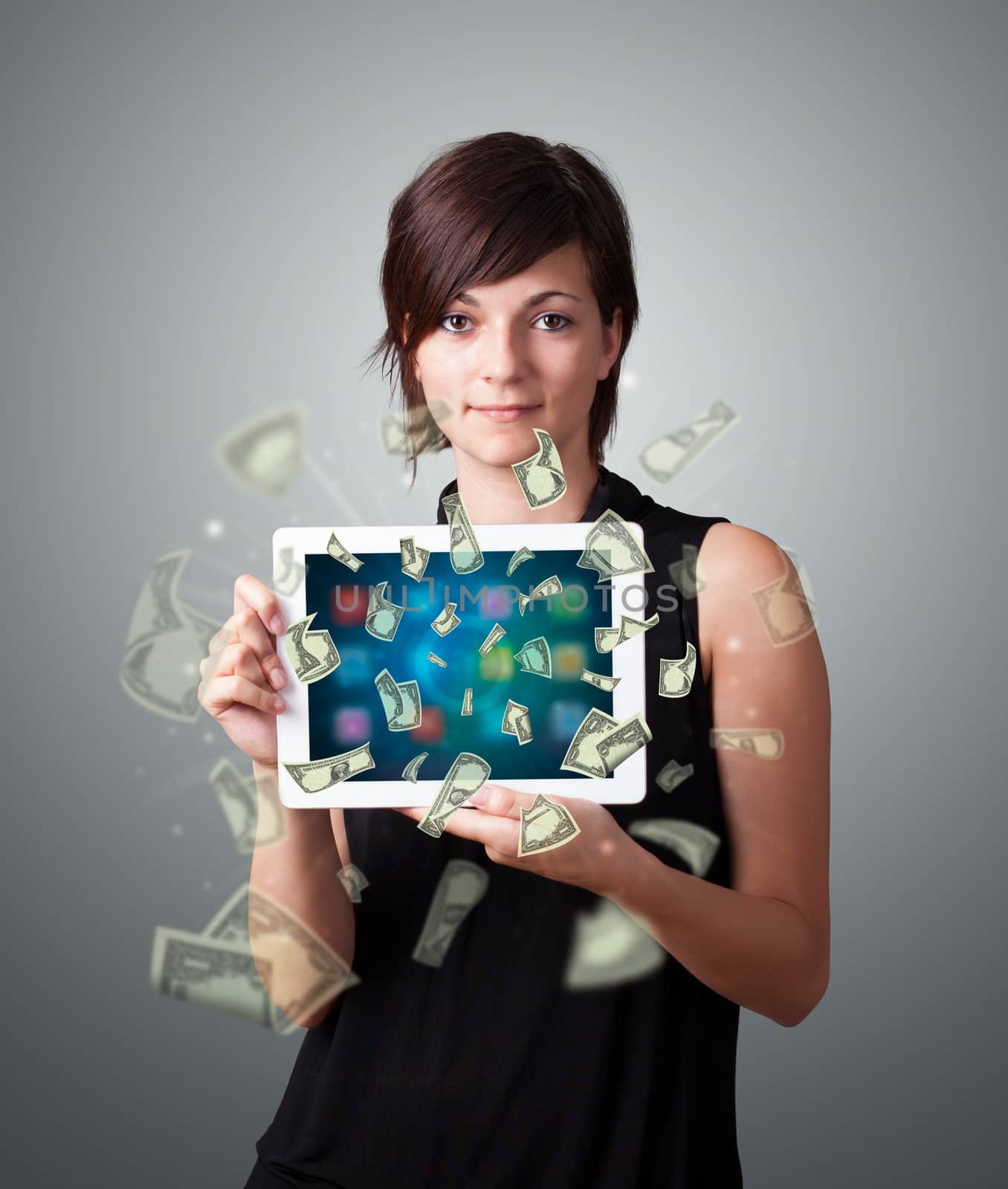 young woman holding tablet with money by ra2studio