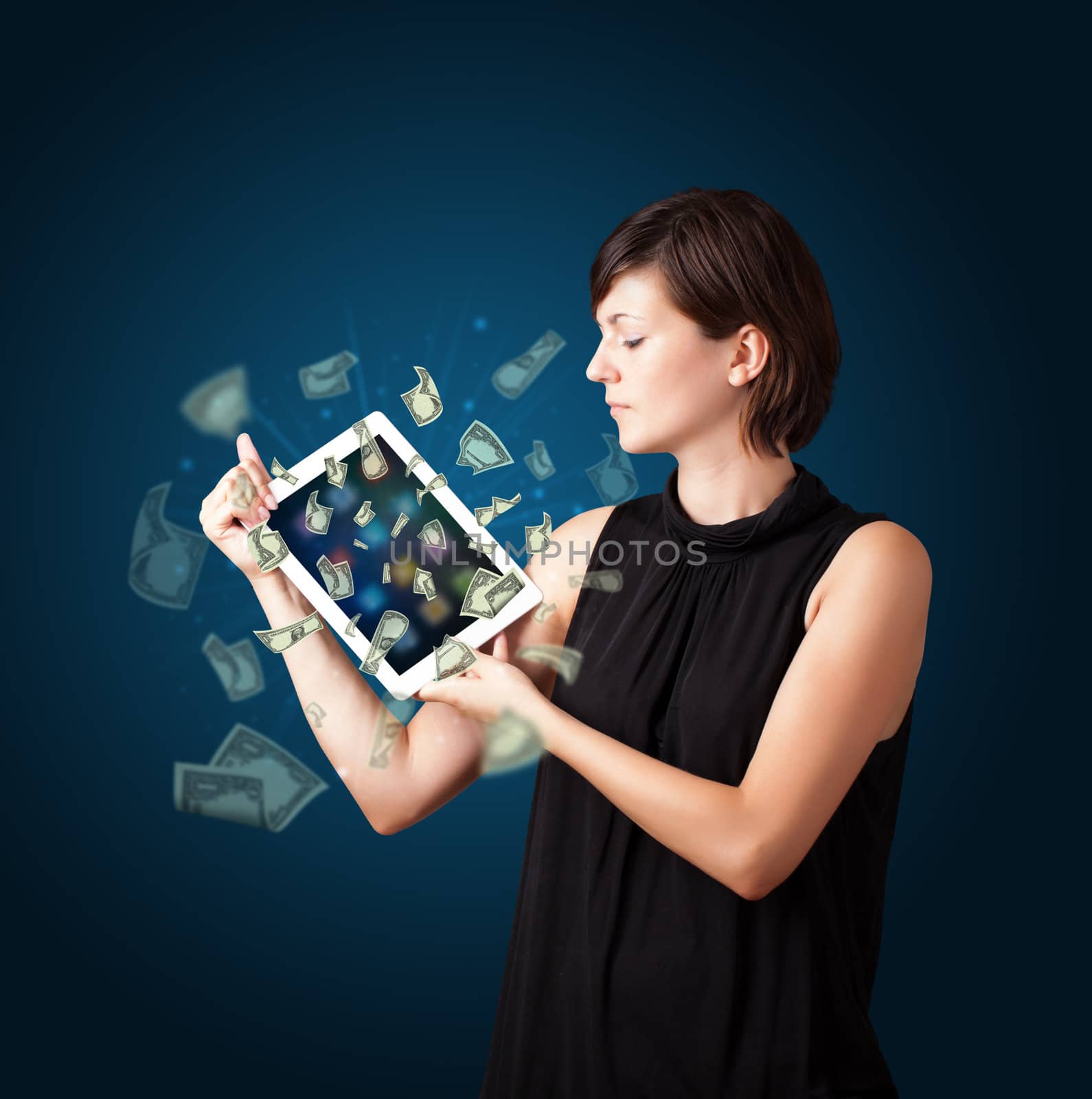 beautiful young woman holding tablet with money