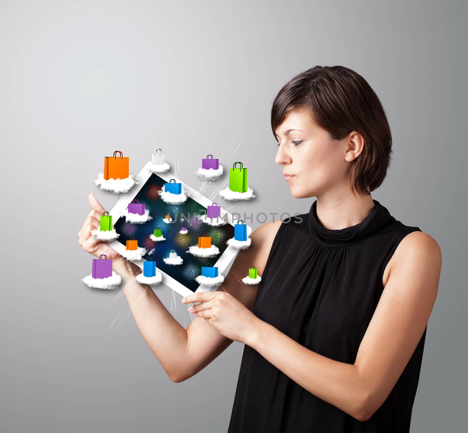 woman holding modern tablet with colorful shopping bags on cloud by ra2studio