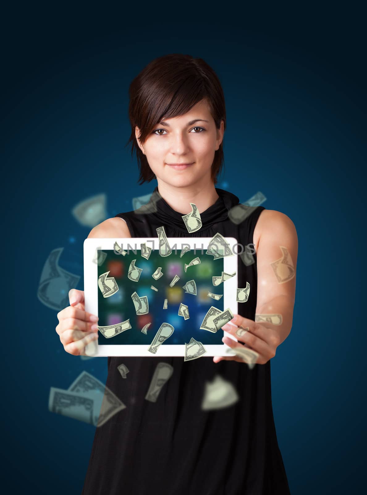 young woman holding tablet with money by ra2studio