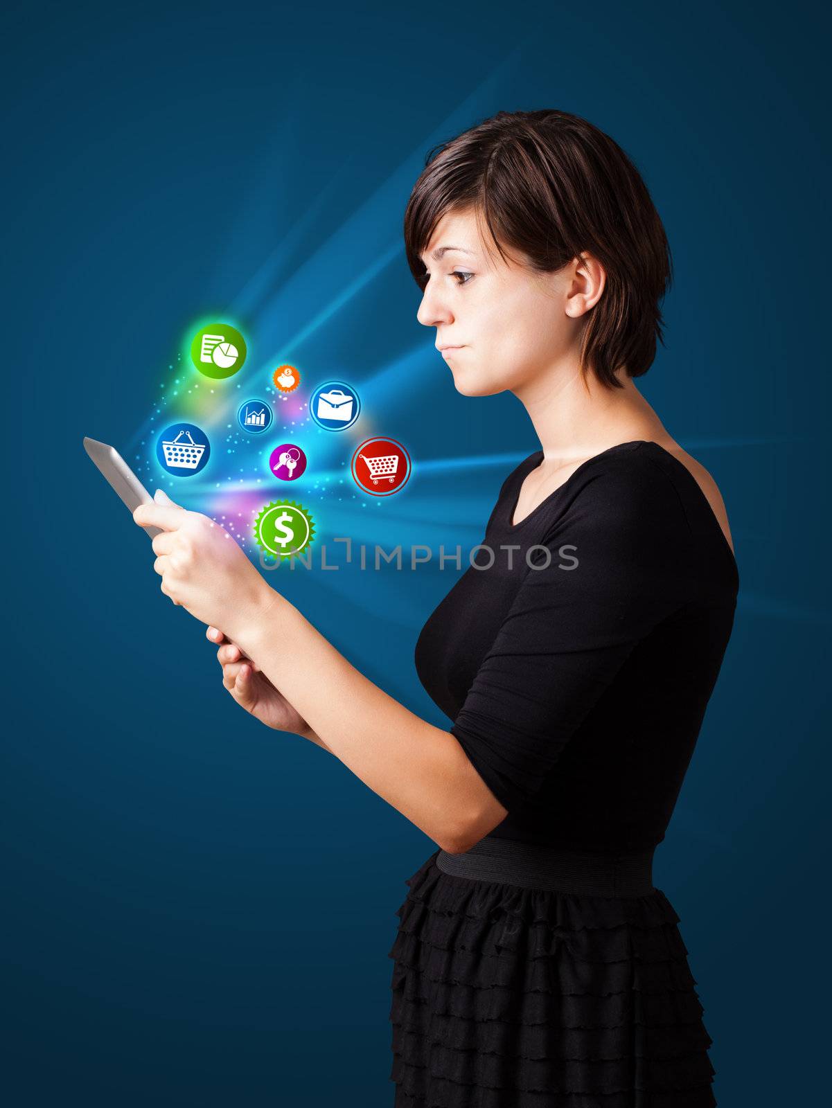 Young woman looking at modern tablet with abstract lights and va by ra2studio