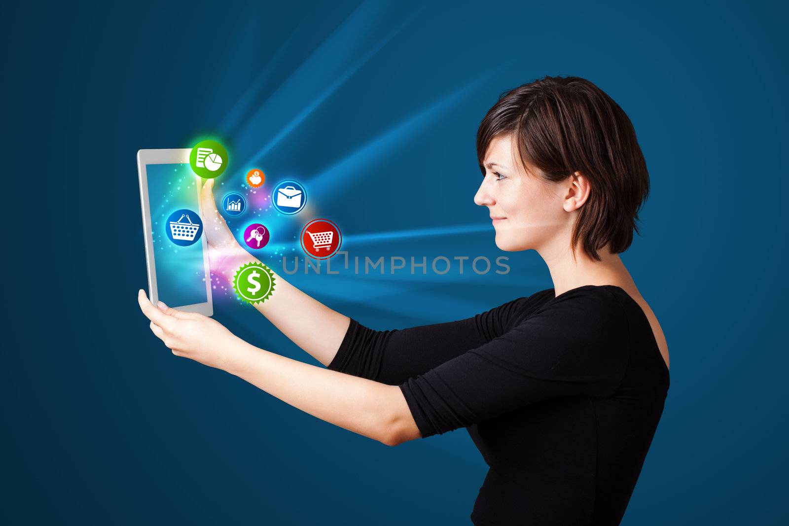 Young business woman looking at modern tablet with abstract lights and various icons