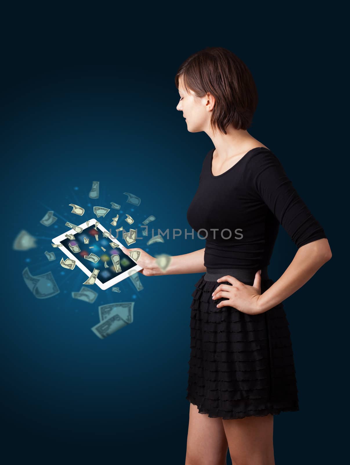 young woman holding tablet with money by ra2studio