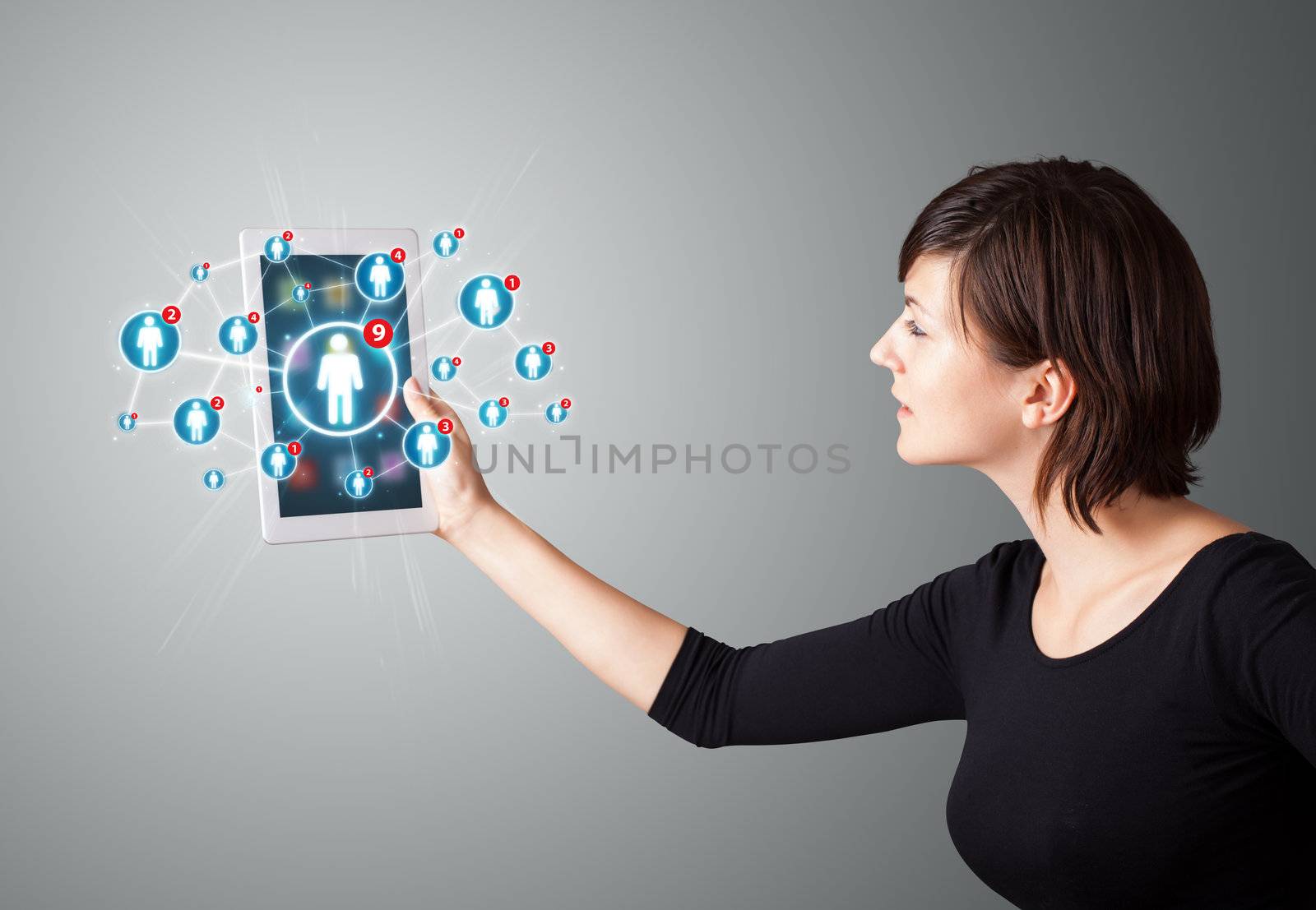 young woman holding tablet with social network icons by ra2studio