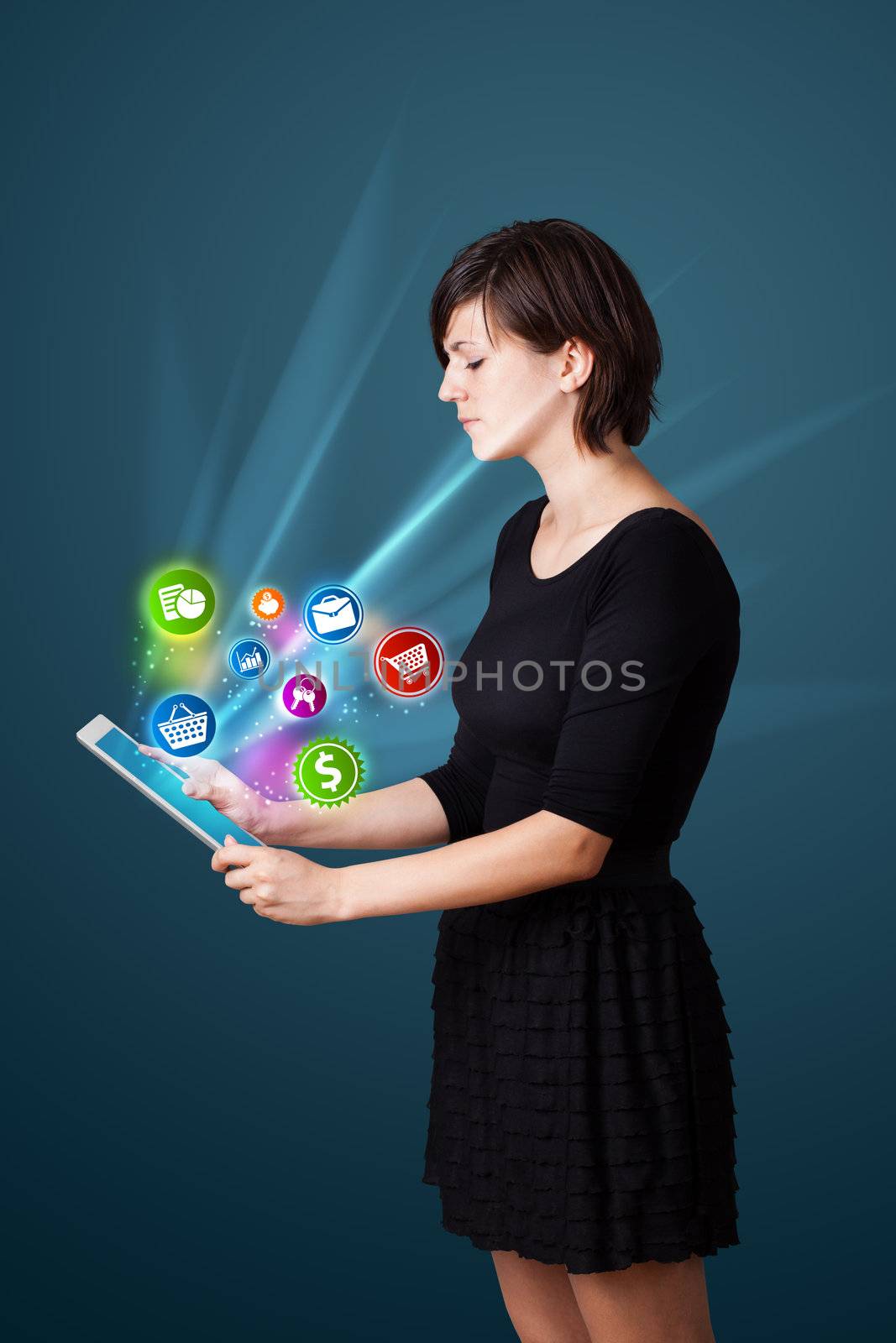 Young business woman looking at modern tablet with abstract lights and various icons