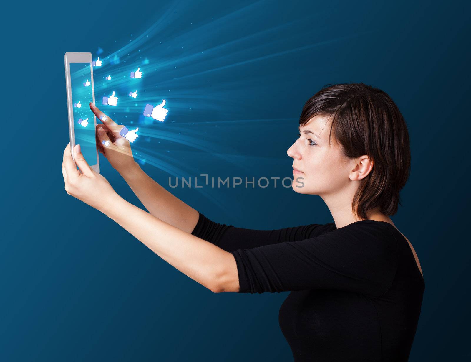 Young business woman looking at modern tablet with abstract lights and social icons