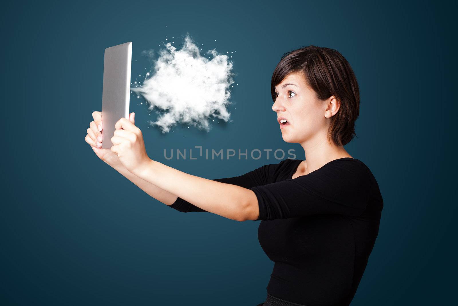 Young woman looking at modern tablet with abstract cloud by ra2studio