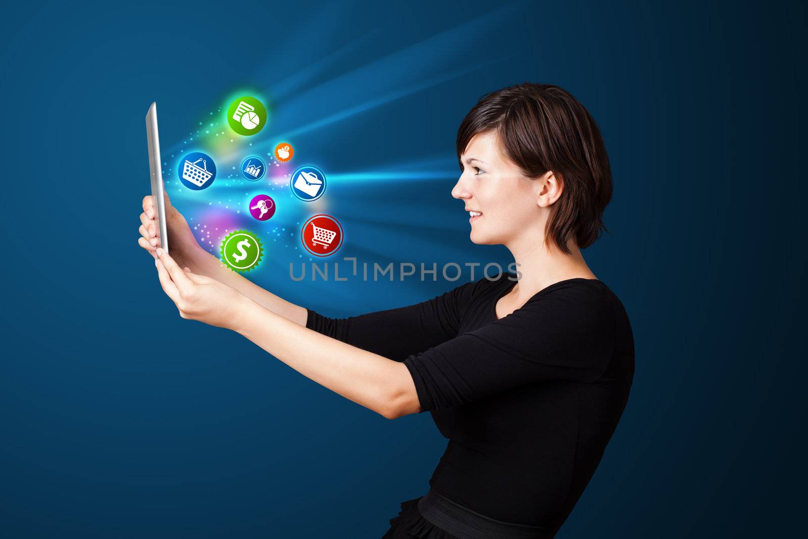 Young business woman looking at modern tablet with abstract lights and various icons