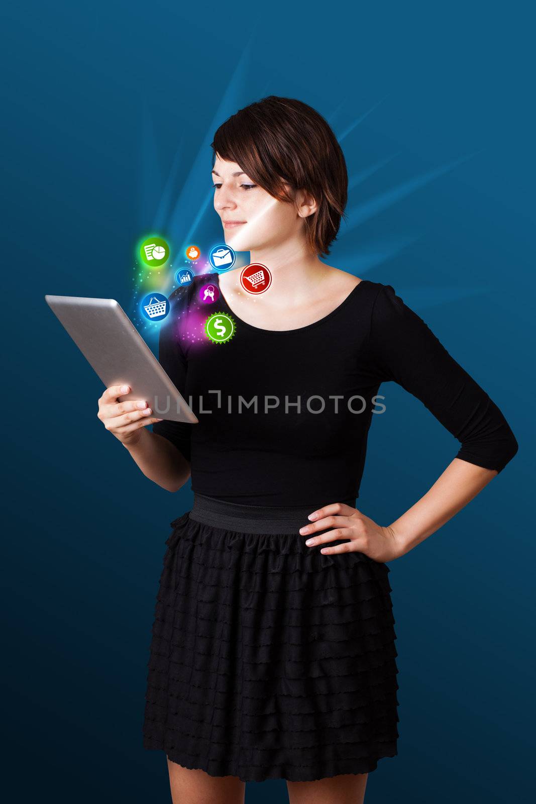 Young business woman looking at modern tablet with abstract lights and various icons