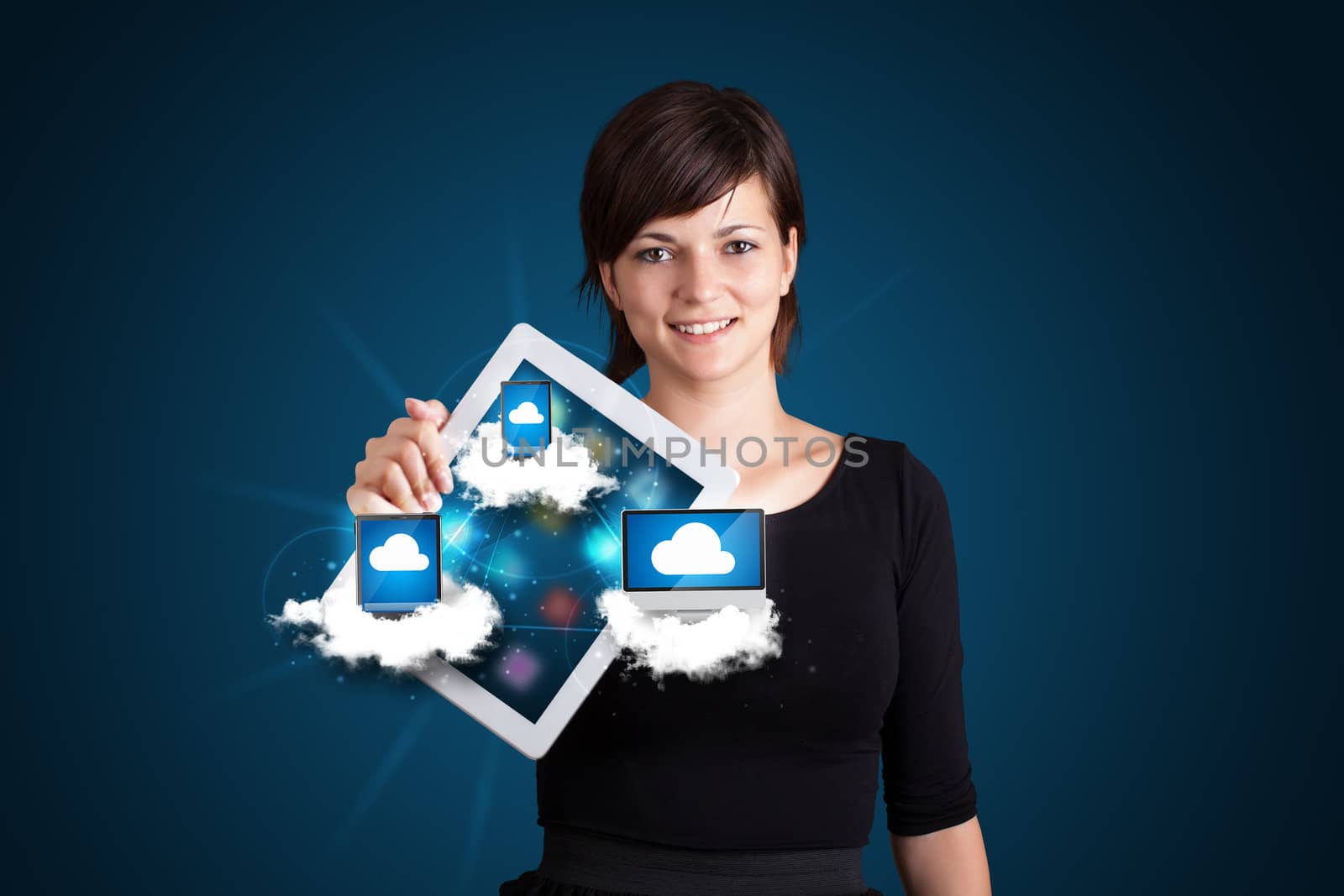 Beautiful young woman holding tablet with modern devices in clouds