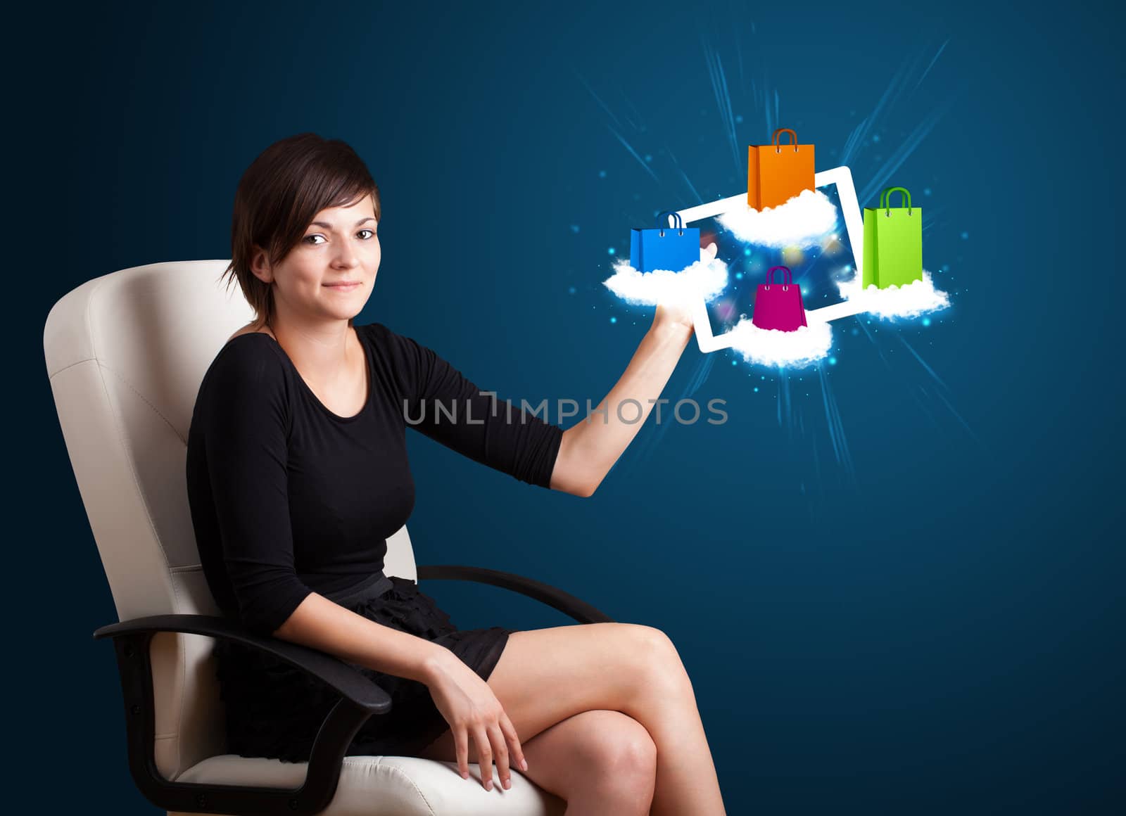 beautiful woman holding modern tablet with colorful shopping bags on clouds