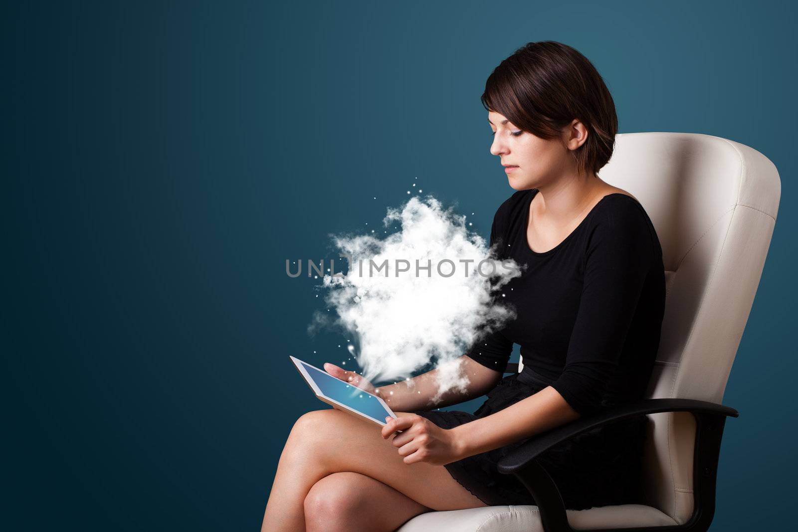 Young business woman looking at modern tablet with abstract cloud