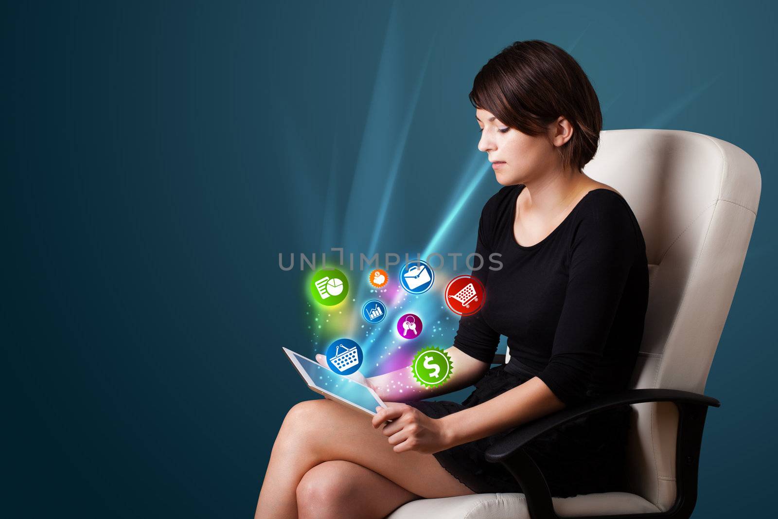 Young business woman looking at modern tablet with abstract lights and various icons