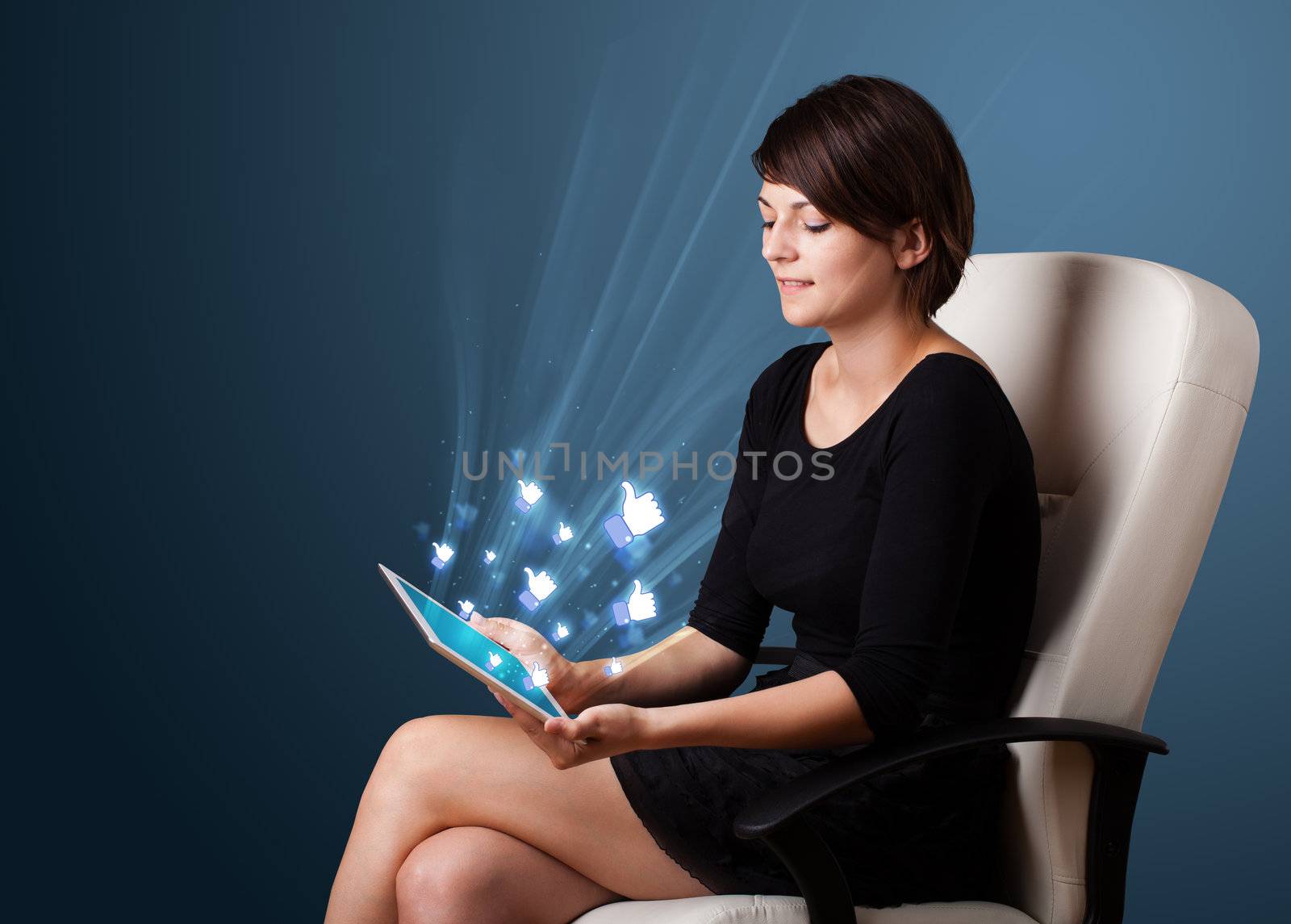 Young woman looking at modern tablet with abstract lights and so by ra2studio