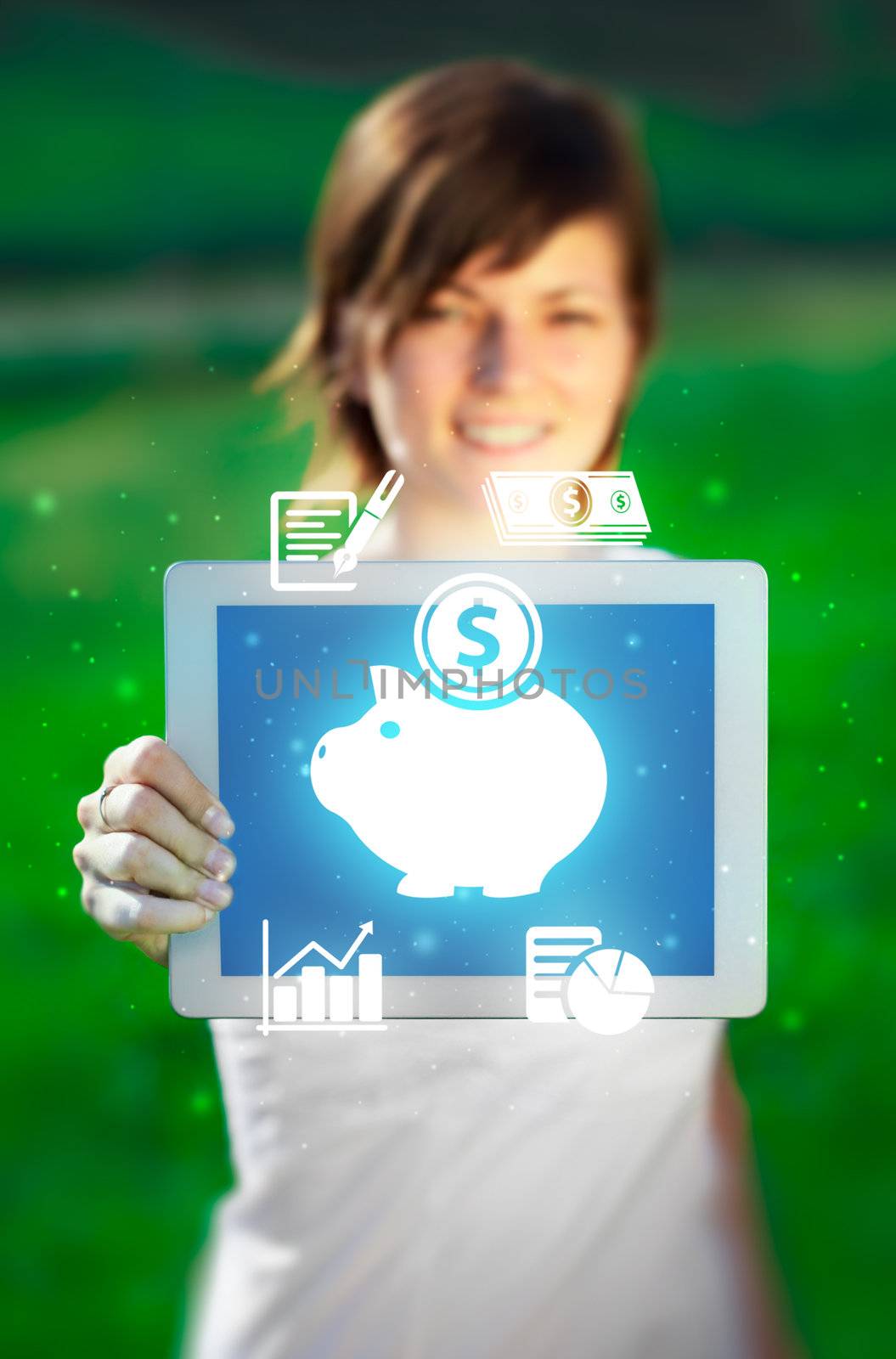 Young business woman looking at modern tablet with abstract light and various diagrams