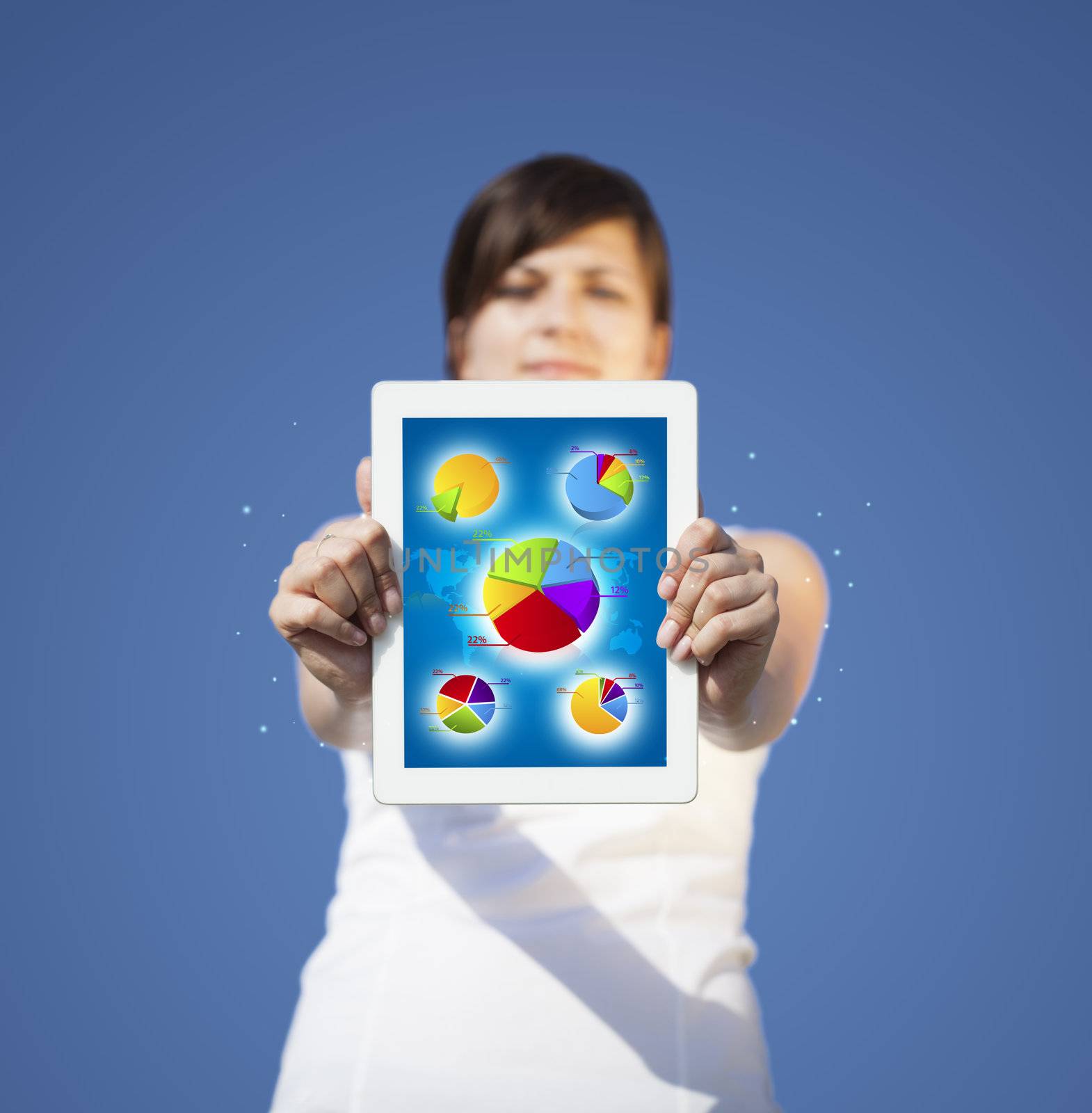 Young business woman looking at modern tablet with abstract light and various diagrams