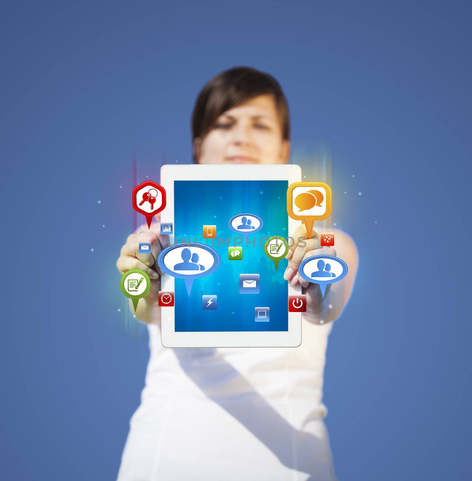 Young business woman looking at modern tablet with abstract lights and social icons